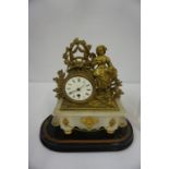 French Gilded Figural Mantel Clock, circa 19th century, Decorated with ormolu mounts, raised on an