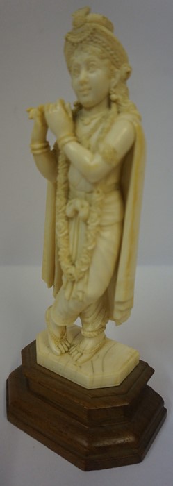 Indian Carved Ivory Figure, Pre 1947, Modelled as Krishna, raised on a wooden base - Image 2 of 2