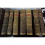 Seven Leather Half Calf Novels by Charles Dickens, circa mid 19th century, also with a 19th