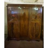 Mahogany Triple Door Wardrobe, Enclosing a hanging rail, fitted shelves and drawers,