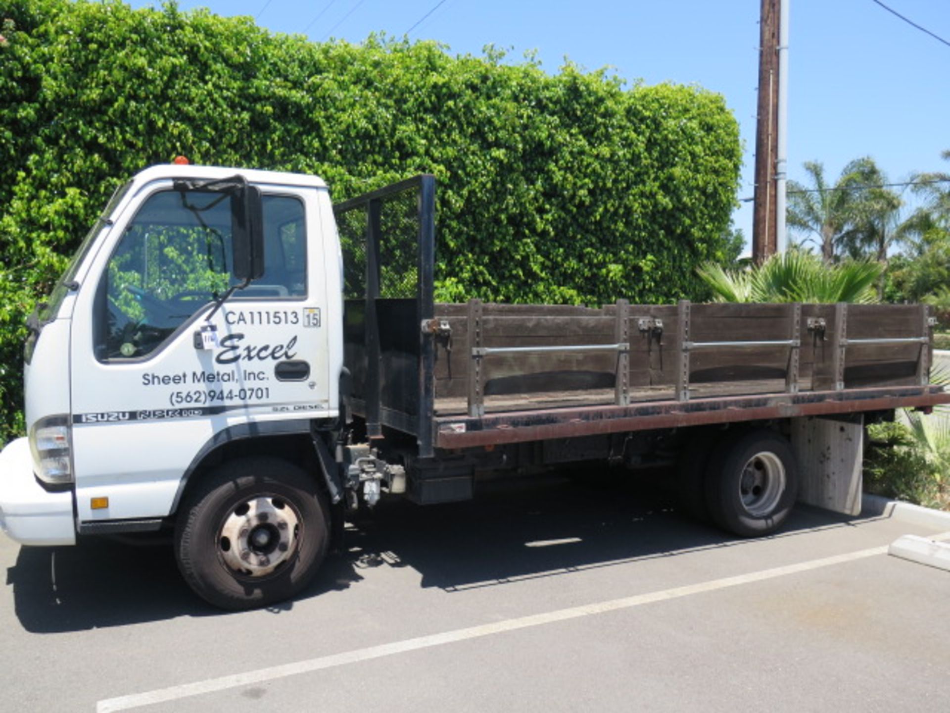 2006 Isuzu NPRHD 12’ Stake Bed Truck Lisc# 8A81262 w/ 5.2L Diesel Engine, Automatic Trans, AC, AM/