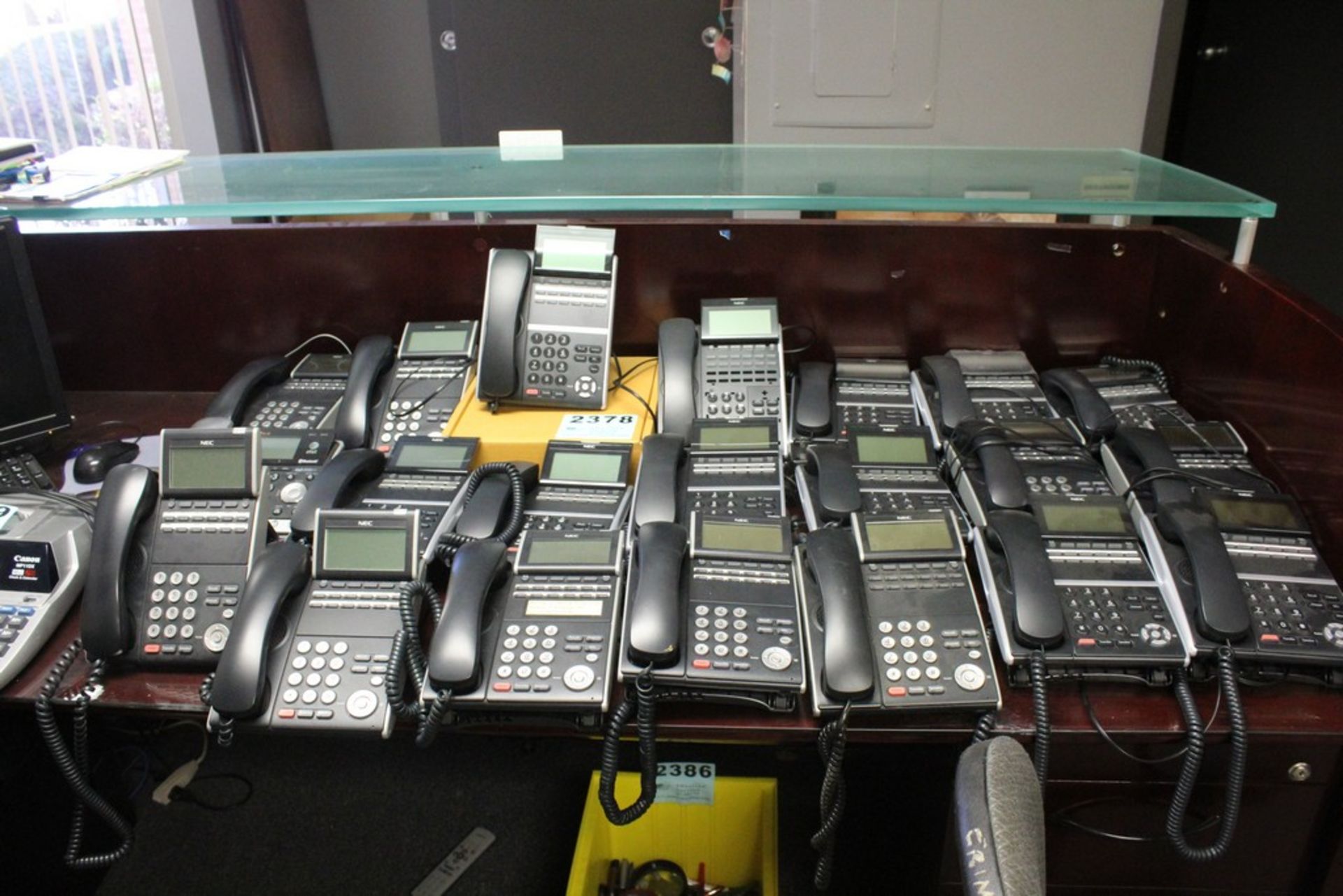 NEC PHONE SYSTEM WITH "ON HOLD" MODULE AND (25) NEC DT700 HANDSETS WITH INFO SCREENS