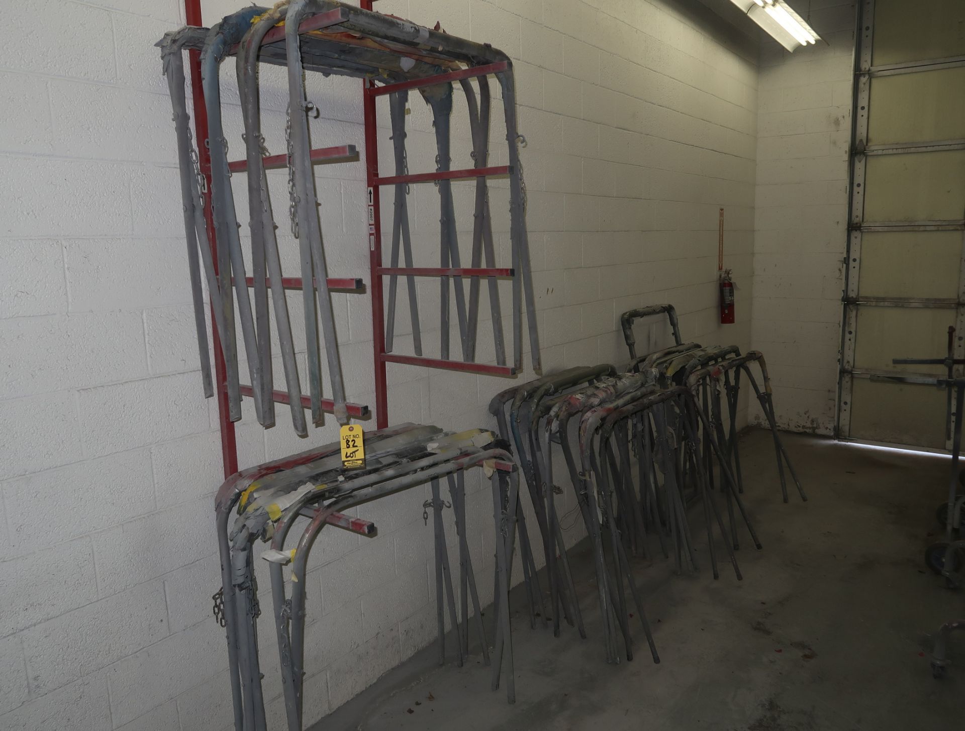LOT WALL MOUNTED RACK & 18-PAINT STANDS