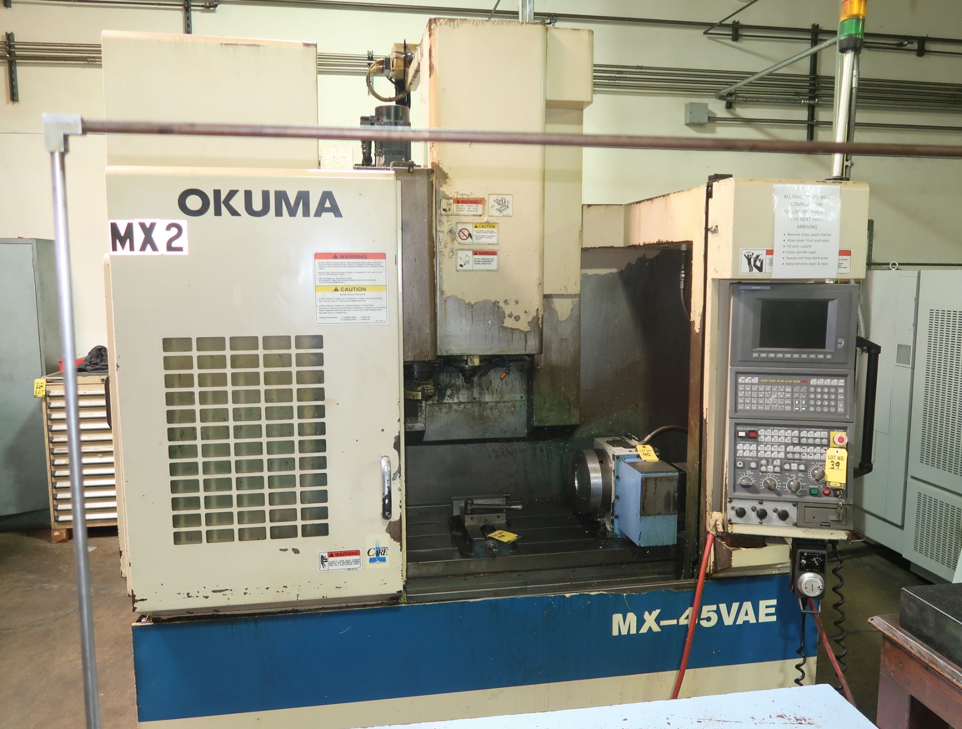 1999 OKUMA MX-45VAE CNC VERTICAL MACHINING CENTER, OSP700M CONTROL, HENNIG CHIP CONVEYOR, SN. 9450