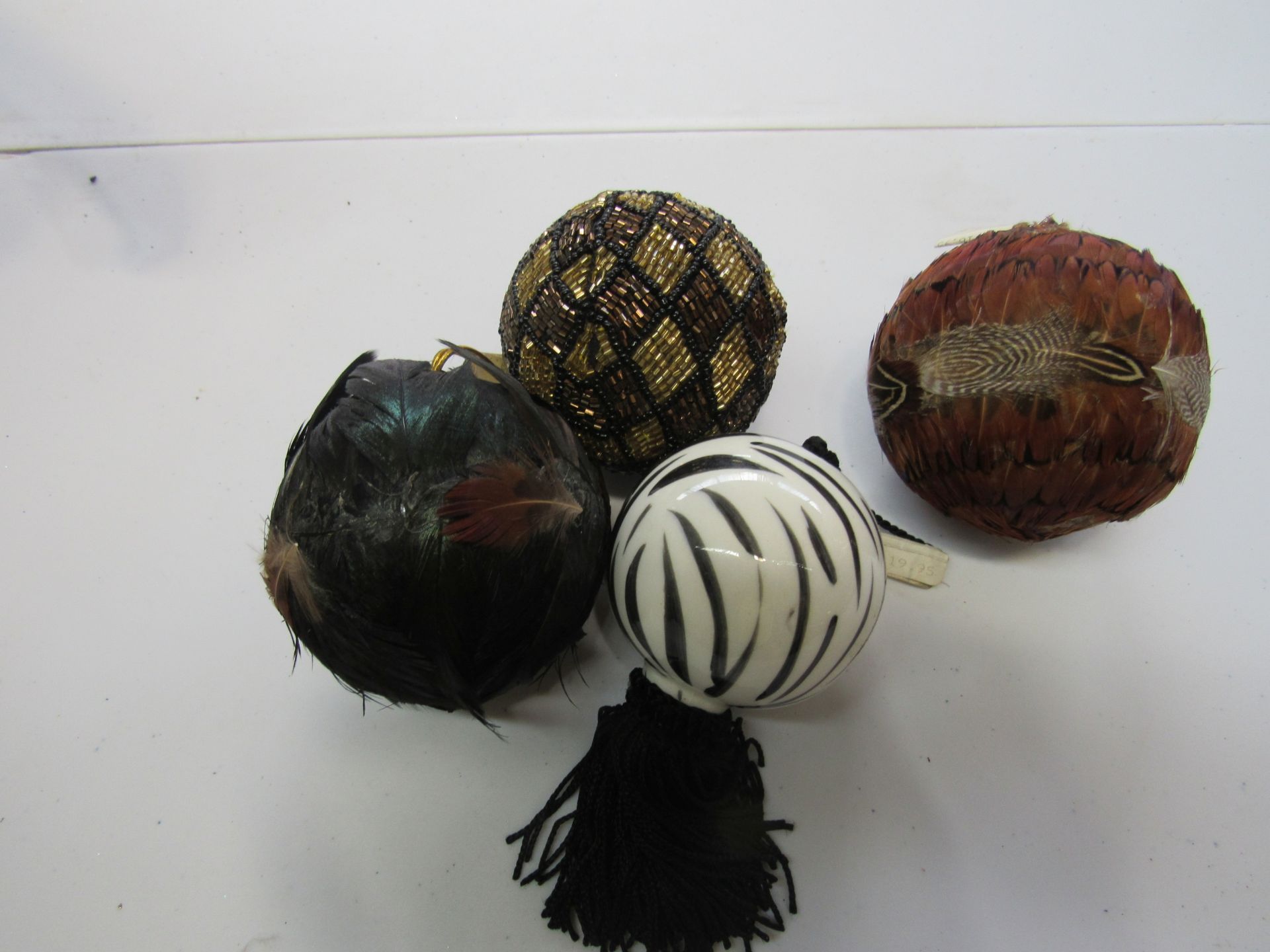 Group of jungle themed ball Christmas ornaments, feathered and beaded
