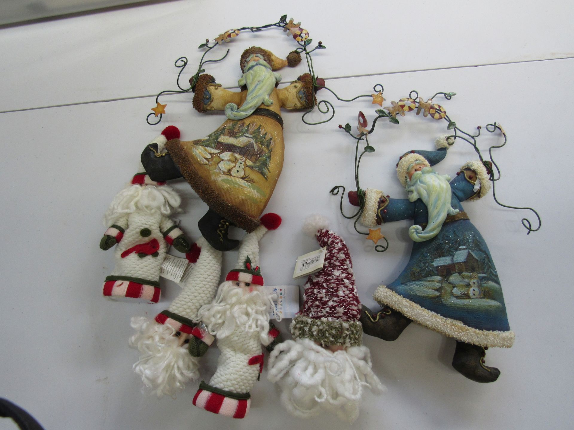 Group of assorted knitted ornaments: Santa Claus, snowmen, etc.