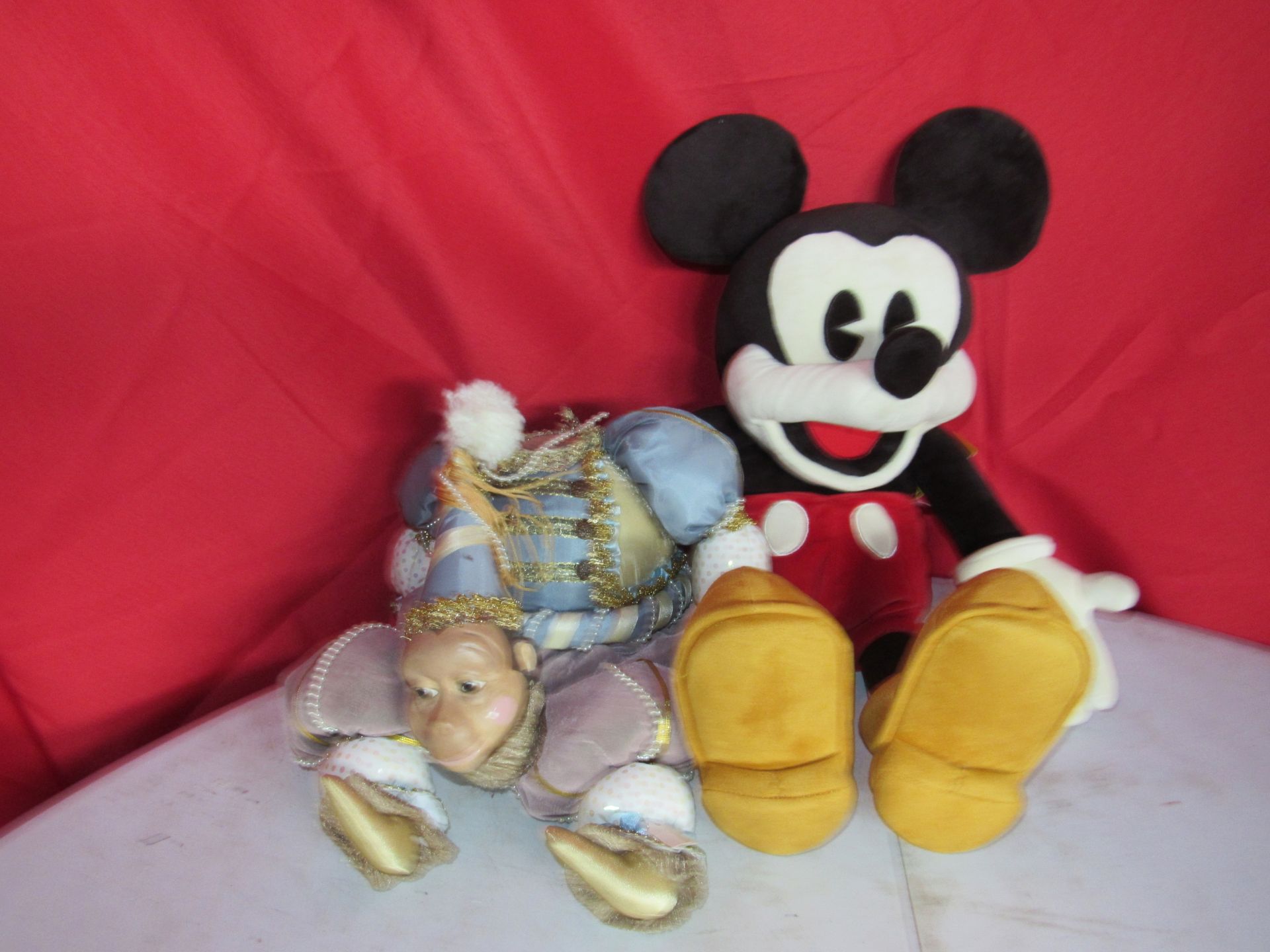 Mickey Mouse puppet and monkey figure