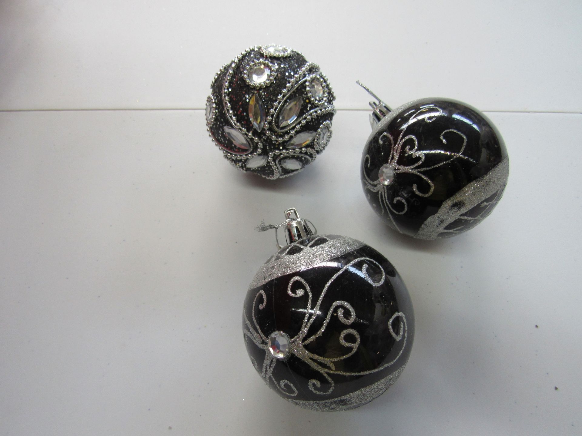 Group of Christmas ornaments with silver and jeweled inlay