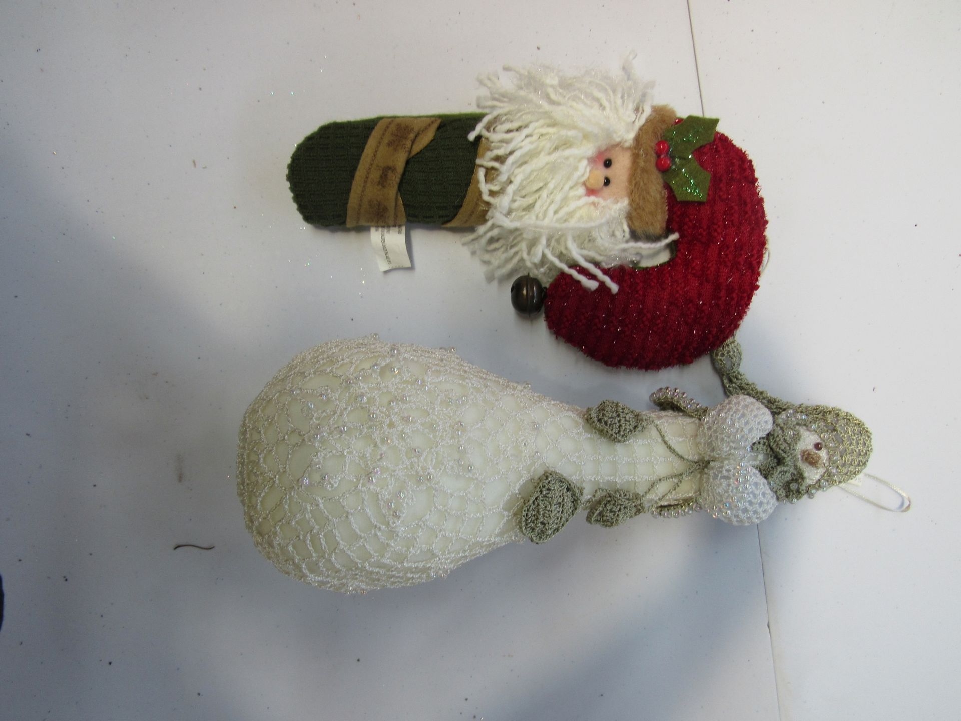 Group of crocheted snowmen and Santa Clauses
