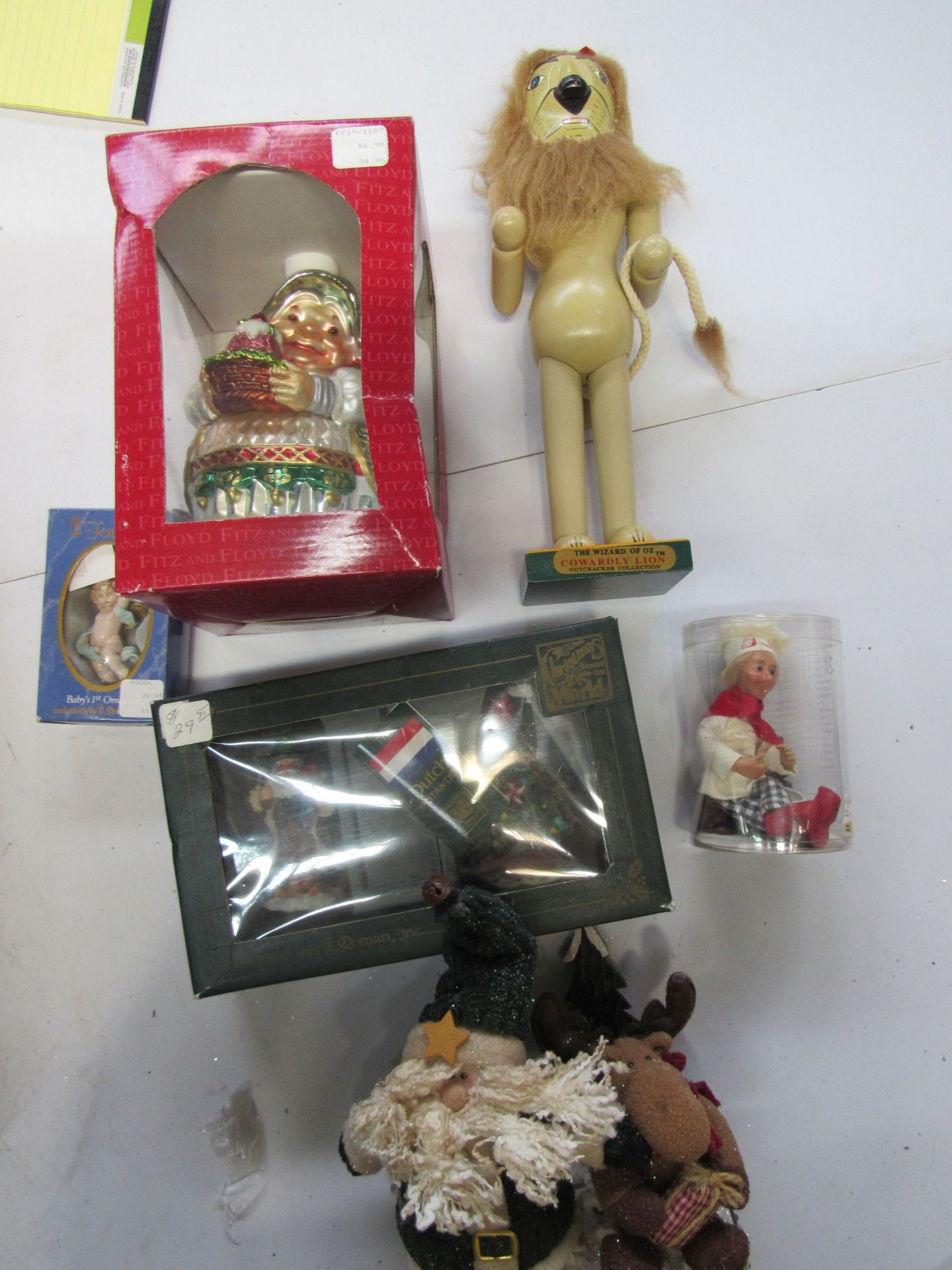 Group of figures and decorations: Cowardly Lion nutcracker, baker, Santa