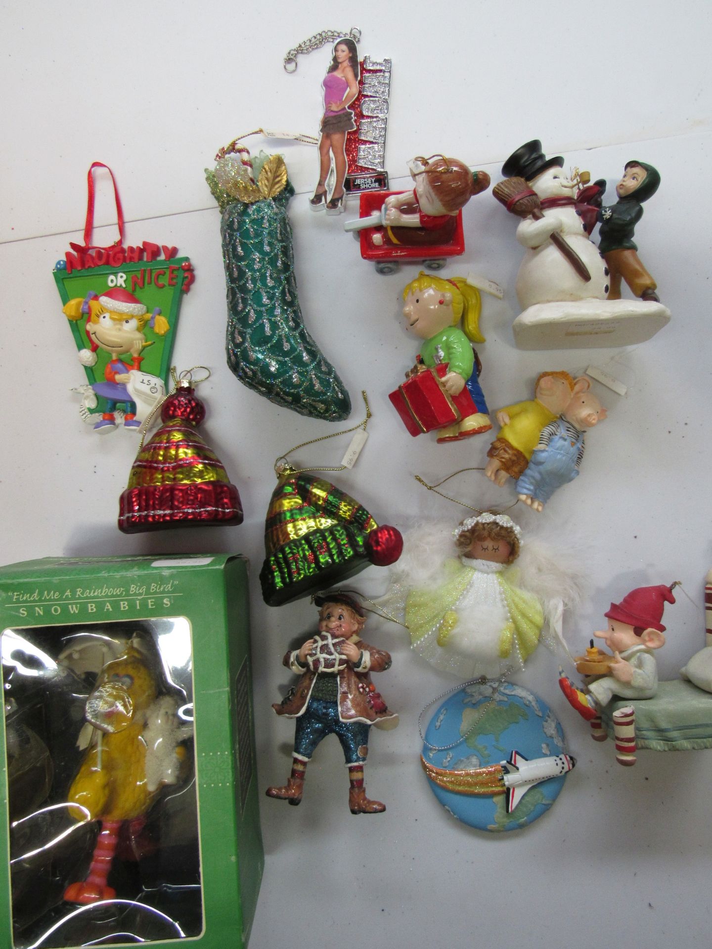 Group of Christmas ornaments: Big Bird, Rugrats, JWoww, space shuttle