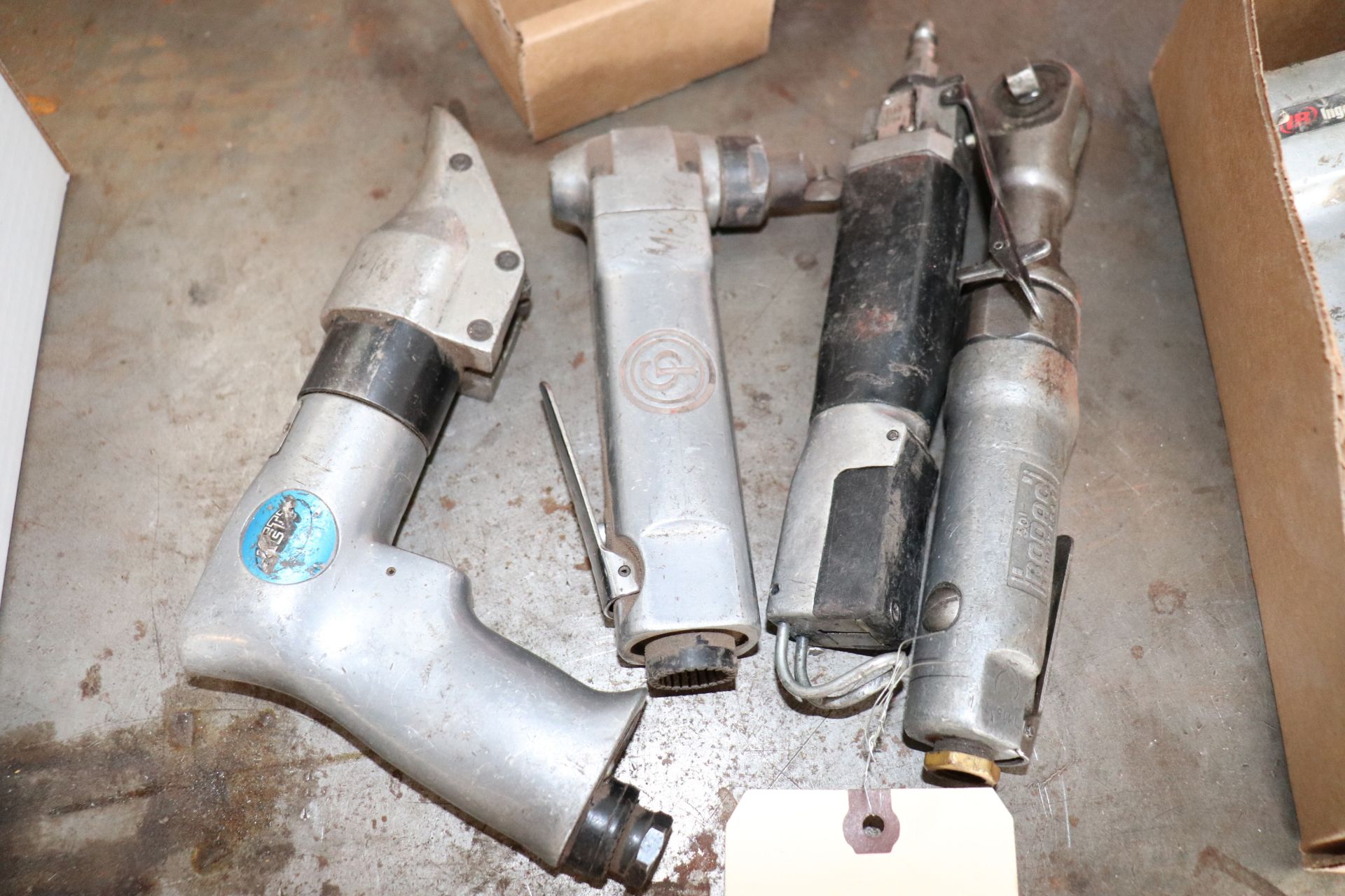 Group of pneumatic nibblers, saw and wrench