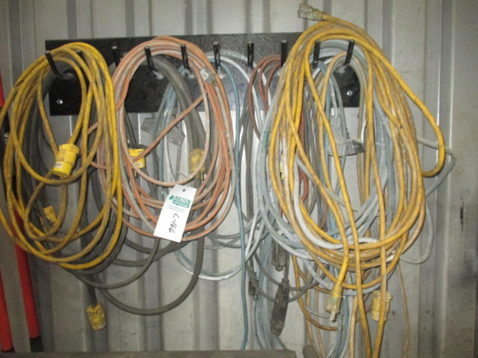Wall Lot of Ext Cords, Approx 12 and 2 Brooms