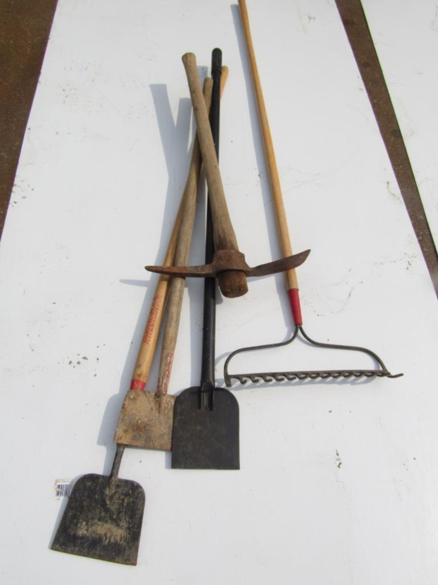 (3) Scrapers, (1) Pick Axe, (1) Rack