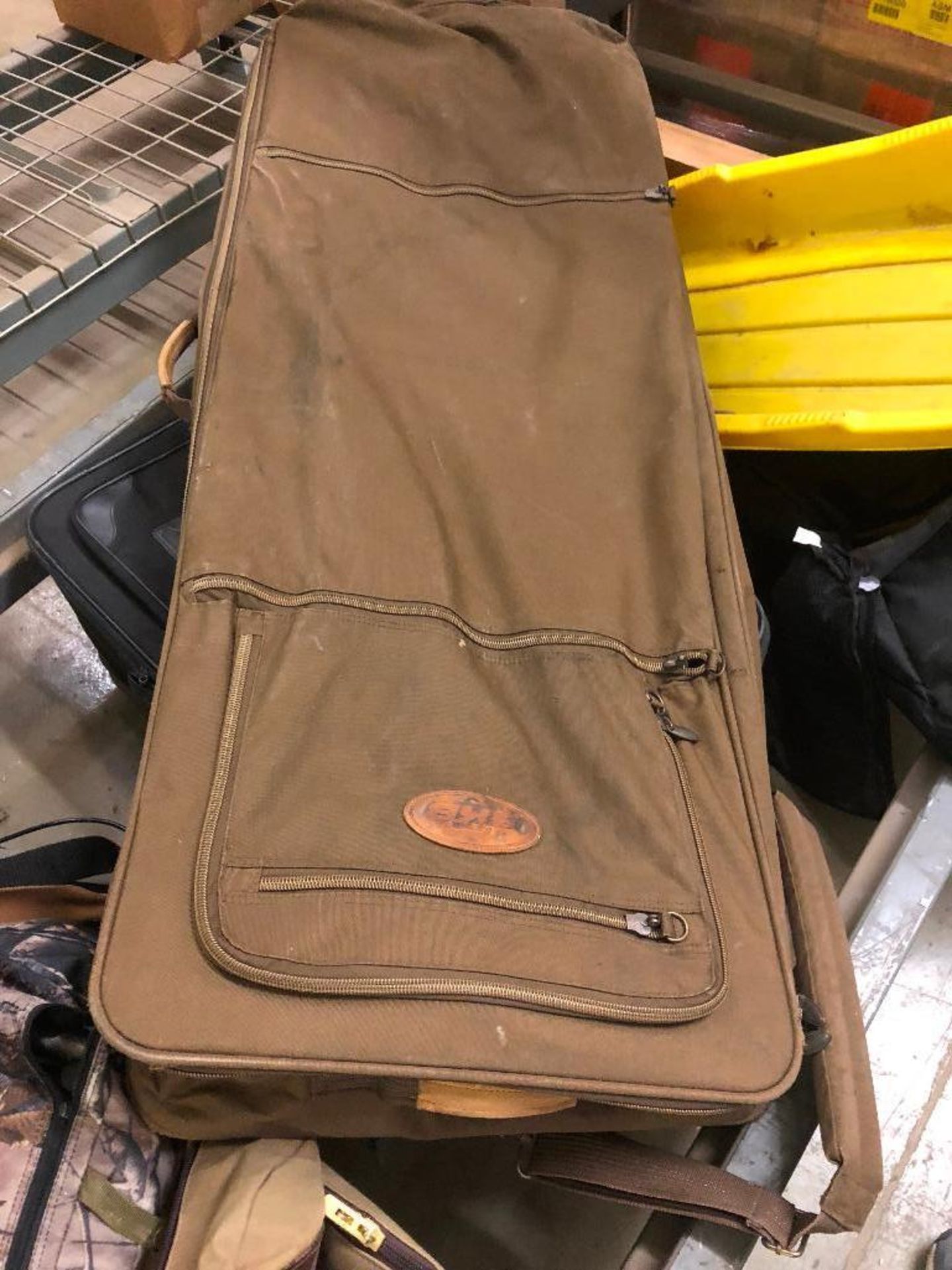 DESCRIPTION: BROWN CANVAS RIFLE CASE. LOCATION: WAREHOUSE QTY: 1