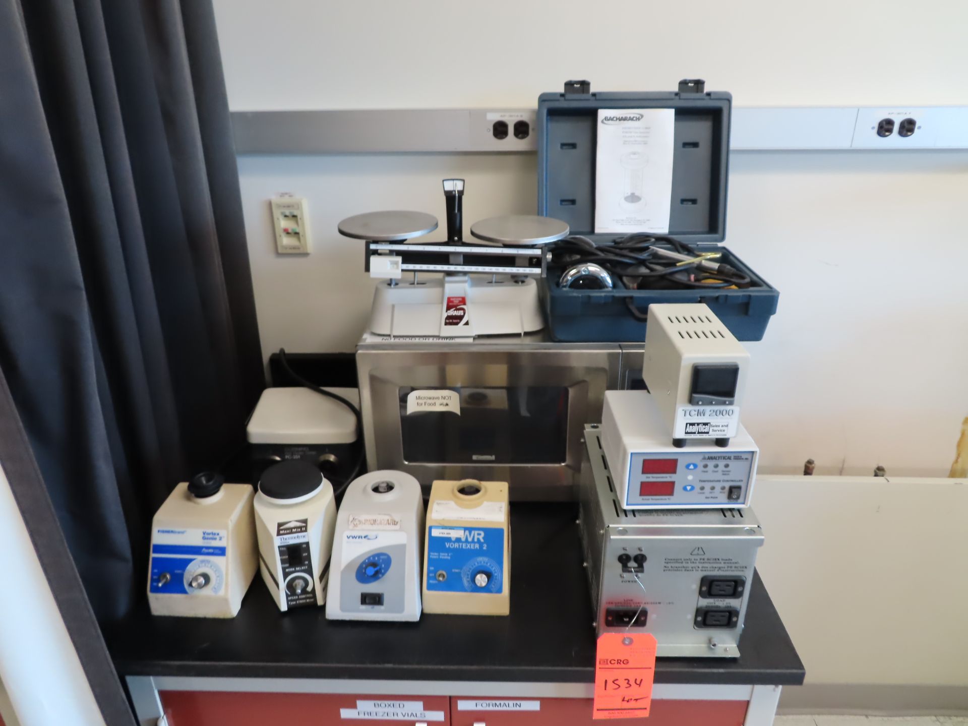 Lot including: (1) power supply, (2) temp controls, (4) stirrers, microwave oven, Ohaus beam