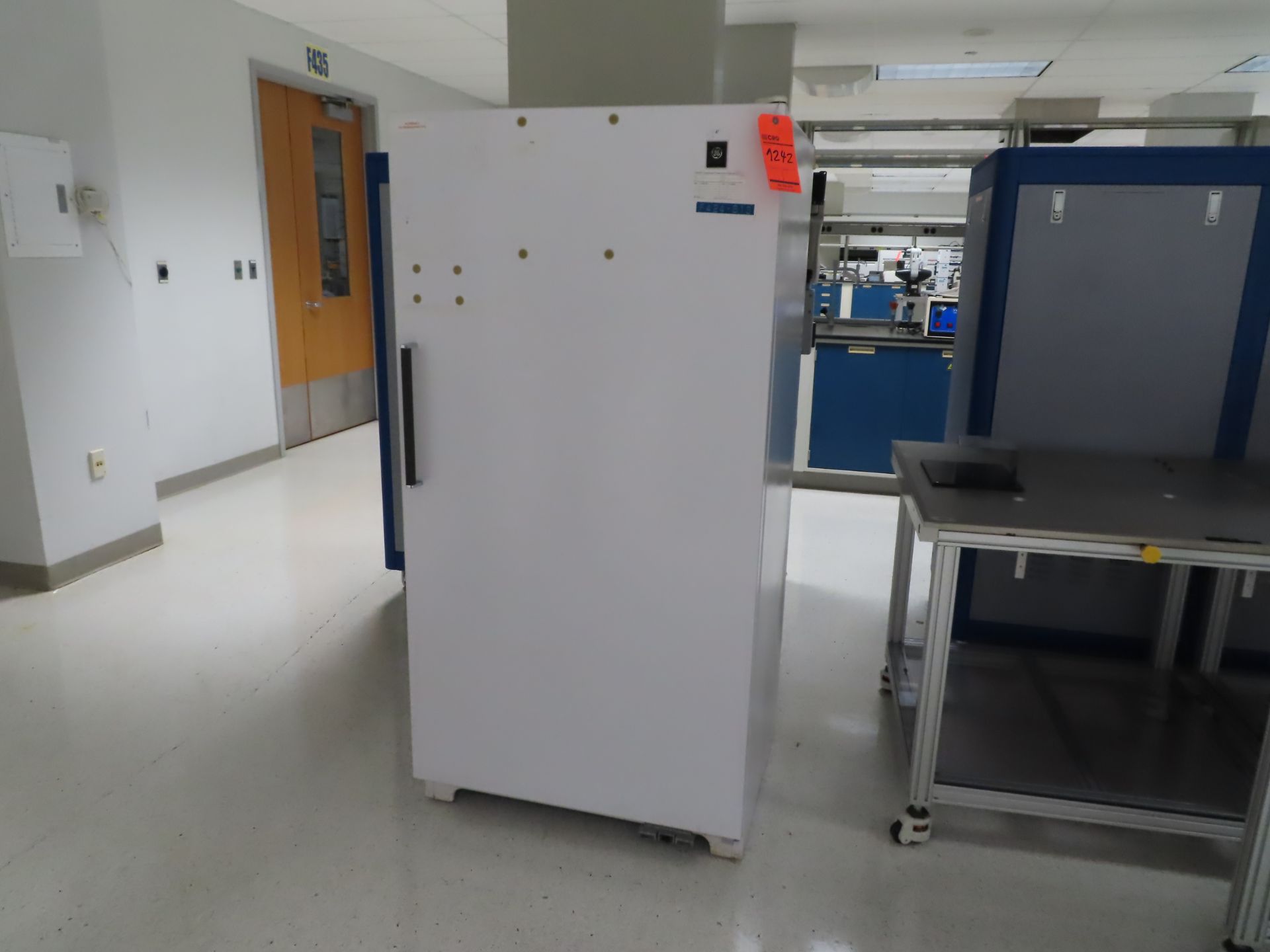 GE single door freezer, located in building 5, 4th floor, room F485