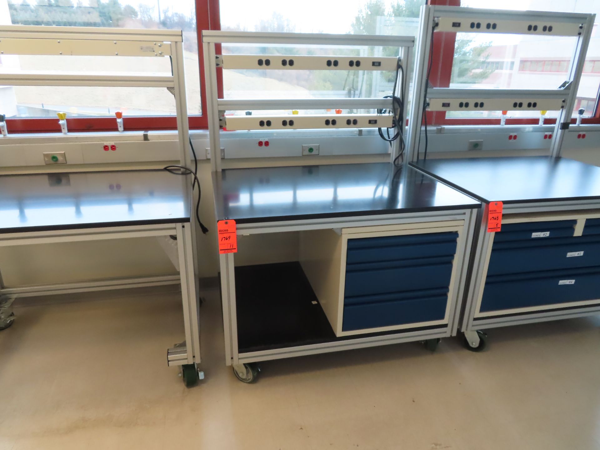 Lot of (11) rolling lab tables with drawers and electric plug panels, located in B wing, 4th