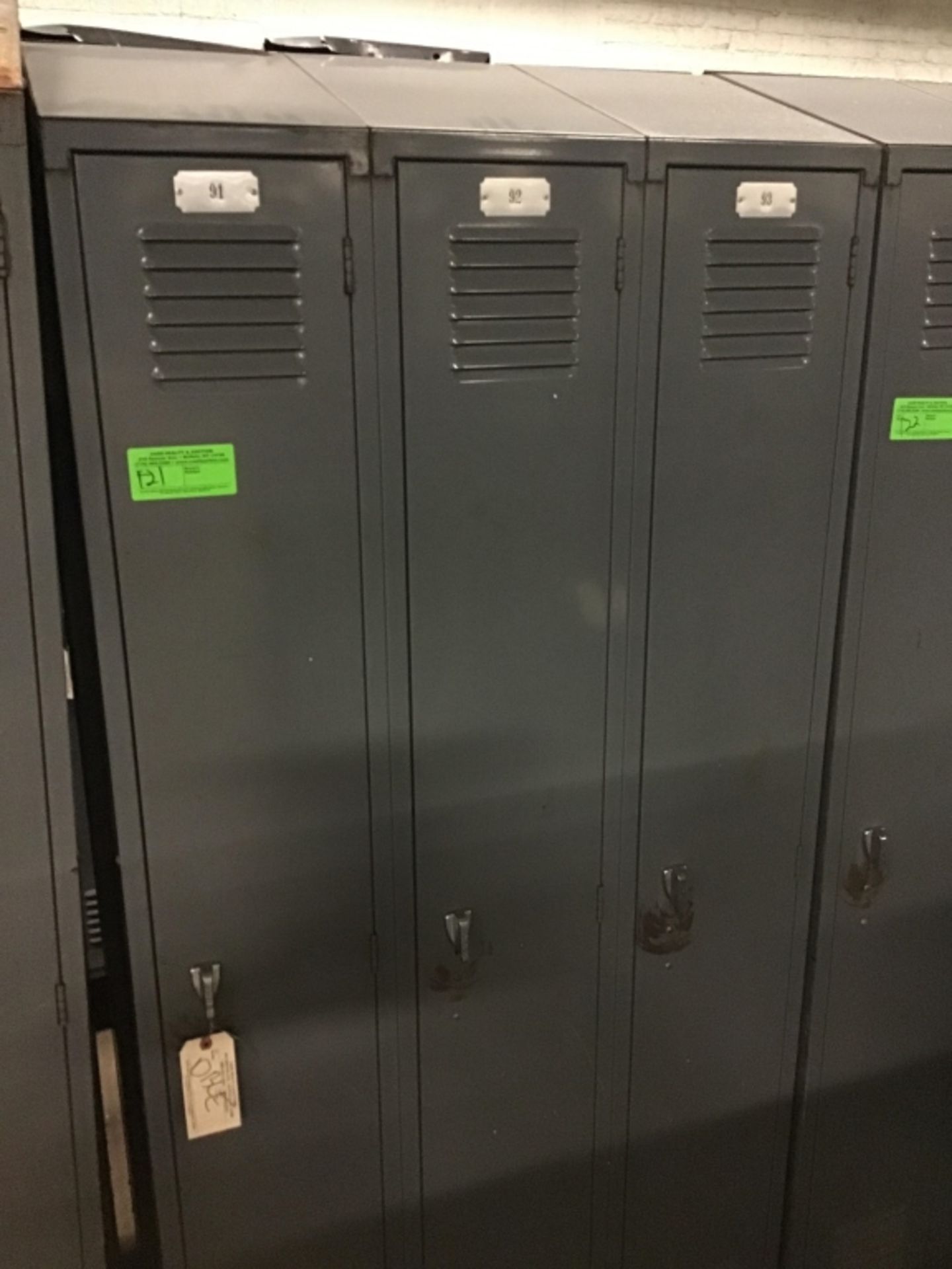 Three sections of double-sided locker top banged up on one side