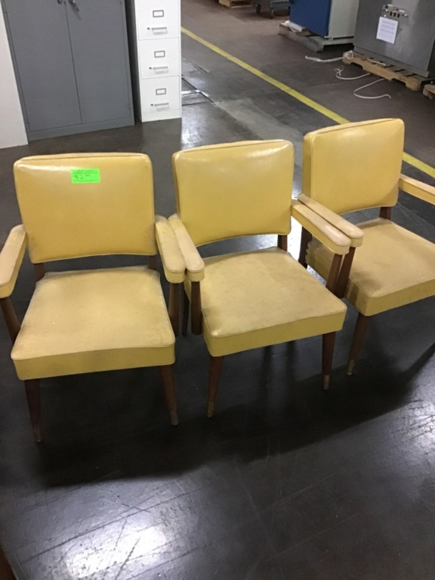 Three vinyl covered chairs