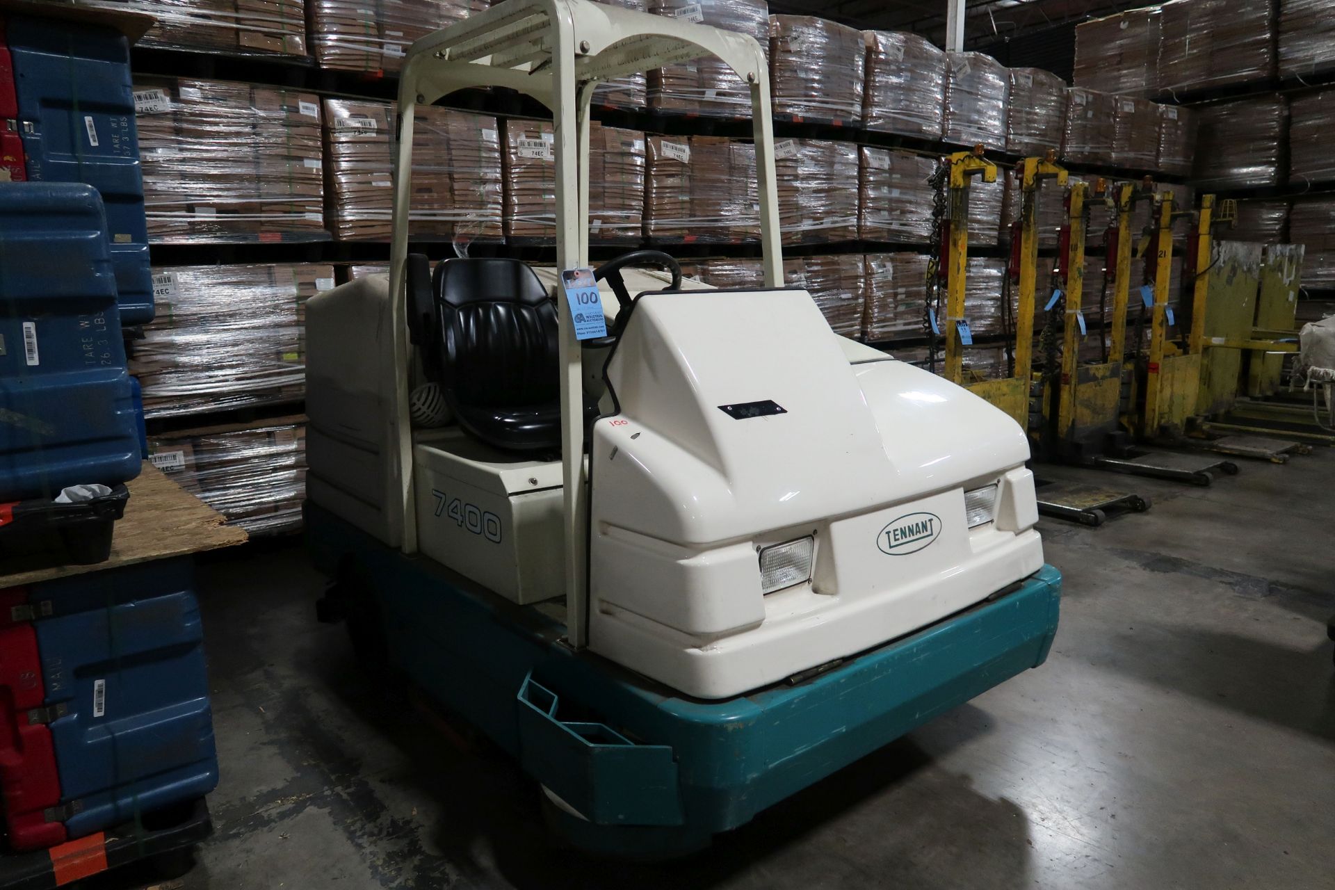 TENNANT MODEL 7400 LP GAS POWERED SIT DOWN TYPE FLOOR SCRUBBER; S/N 7400-6300, GVW 4,600 LB. 220