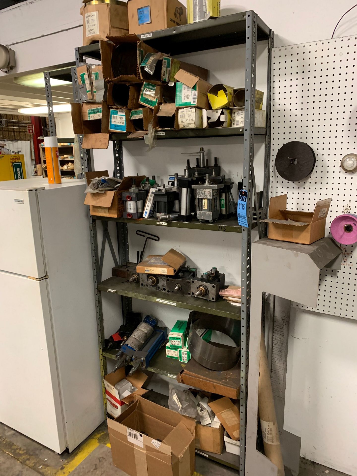 (LOT) SHELVING W/ CONTENTS INCLUDING STEEL SHIM STOCK, HYDRAULIC ACTUATORS & GRINDING WHEELS