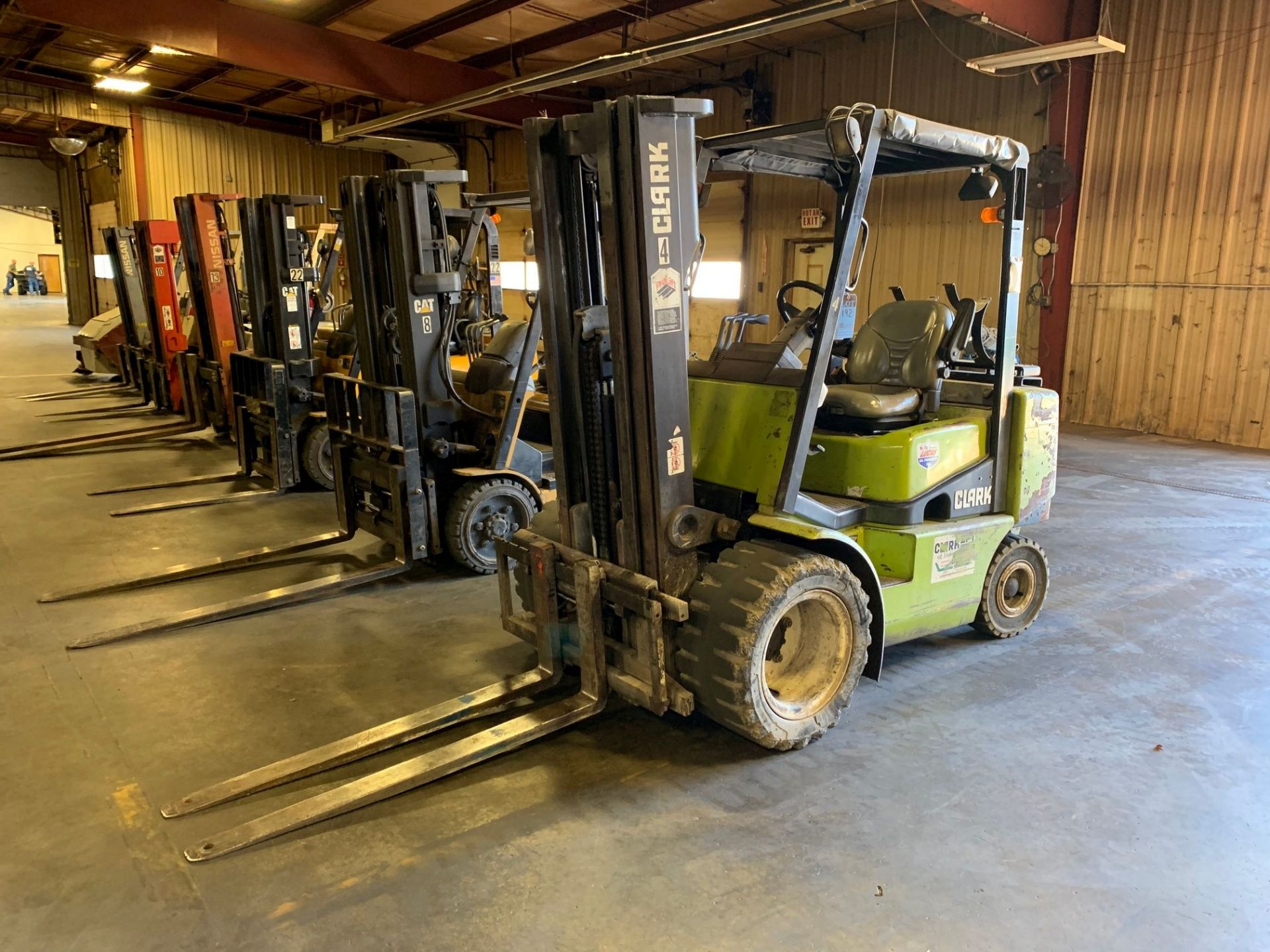 5,000 LB. CLARK MODEL CGP25 LP GAS SOLID TIRE THREE STAGE MAST LIFT TRUCK; S/N 9466FB, 5,889 HOURS