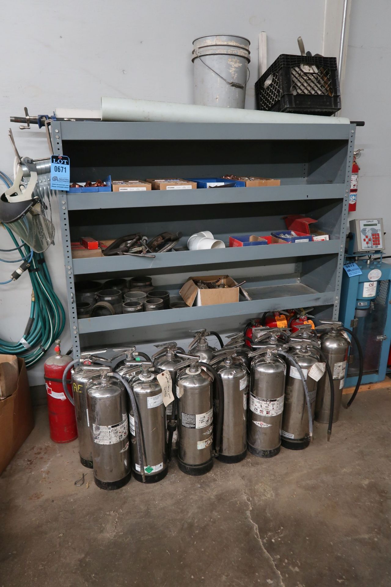 CONTENTS OF SHELF INCLUDING FIRE EXTINGUISHERS, C-CLAMPS, PIPE FITTINGS, HARDWARE, POLE CLAMPS