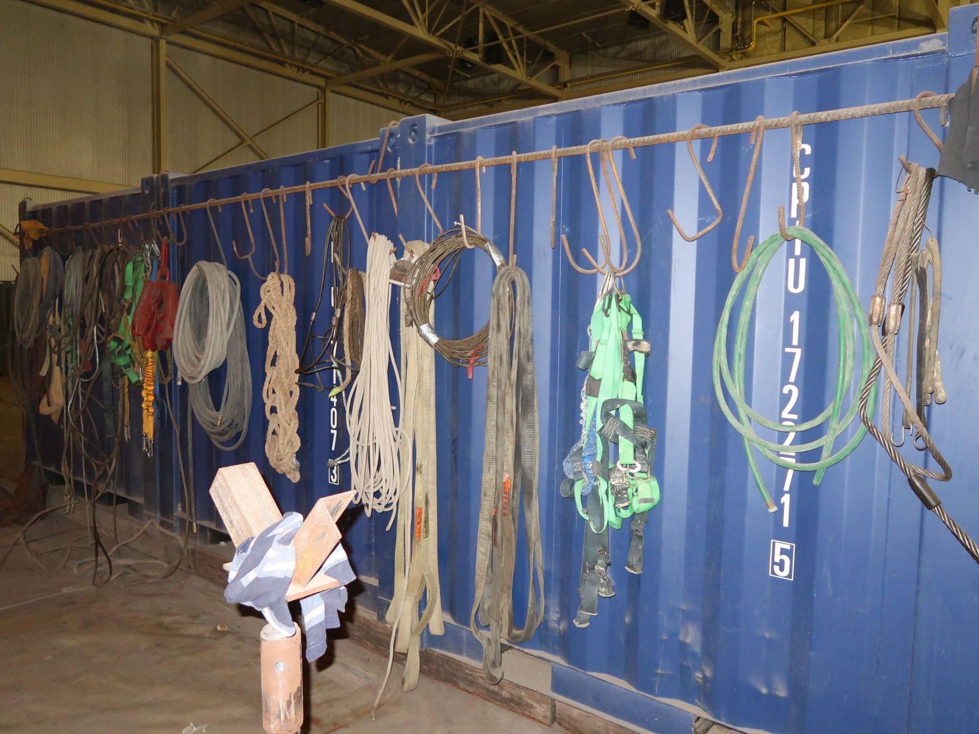 CONTENTS OF REAR OF CONTAINER INCLUDING HOSES, LIFTING STRAPS AND CABLES, SAFETY HARNESSES