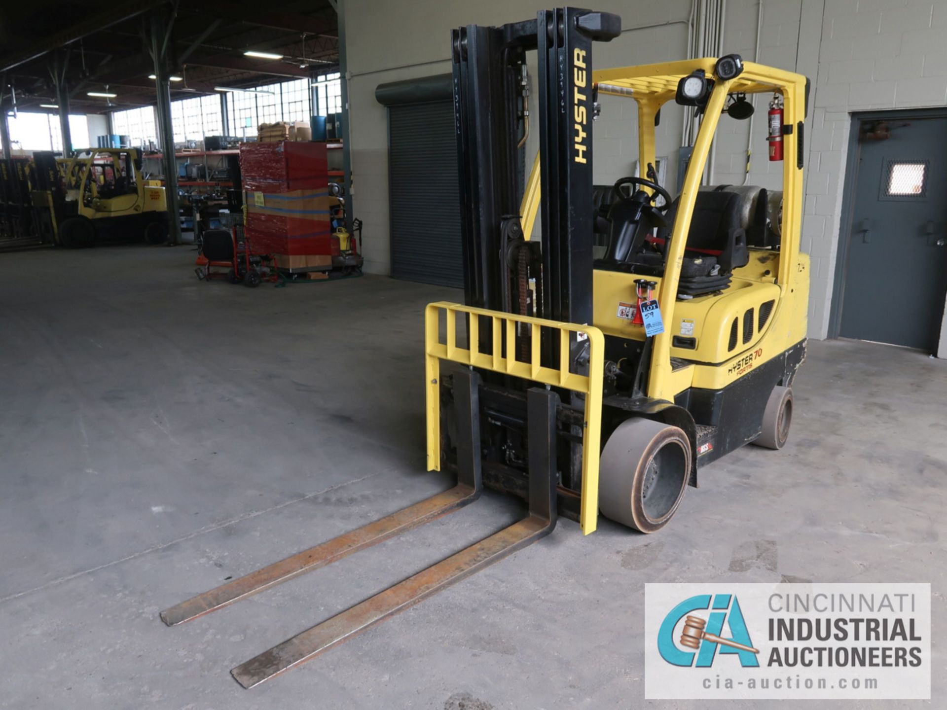 7,000 LB HYSTER MODEL S70FT LP GAS SOLID TIRE LIFT TRUCK WITH 3-STAGE MAST, 188" LIFT HEIGHT, 84"