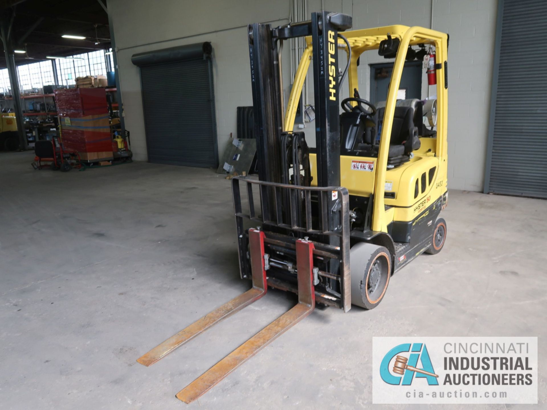 5,000 LB HYSTER MODEL S50FT LP GAS SOLID TIRE LIFT TRUCK WITH 2-STAGE MAST, 130" LIFT HEIGHT, 80"