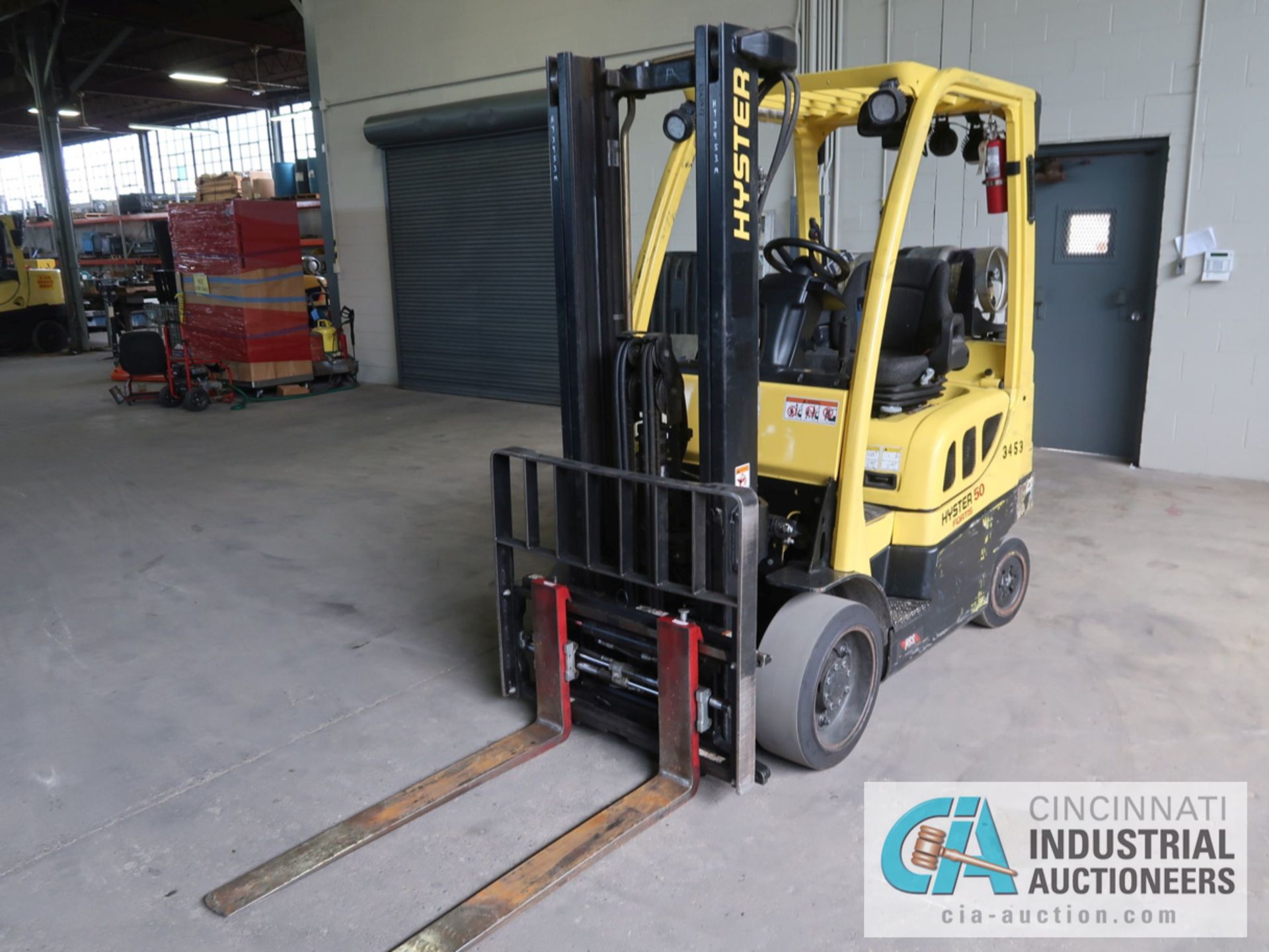 5,000 LB HYSTER MODEL S50FT LP GAS SOLID TIRE LIFT TRUCK WITH 2-STAGE MAST, 130" LIFT HEIGHT, 80"