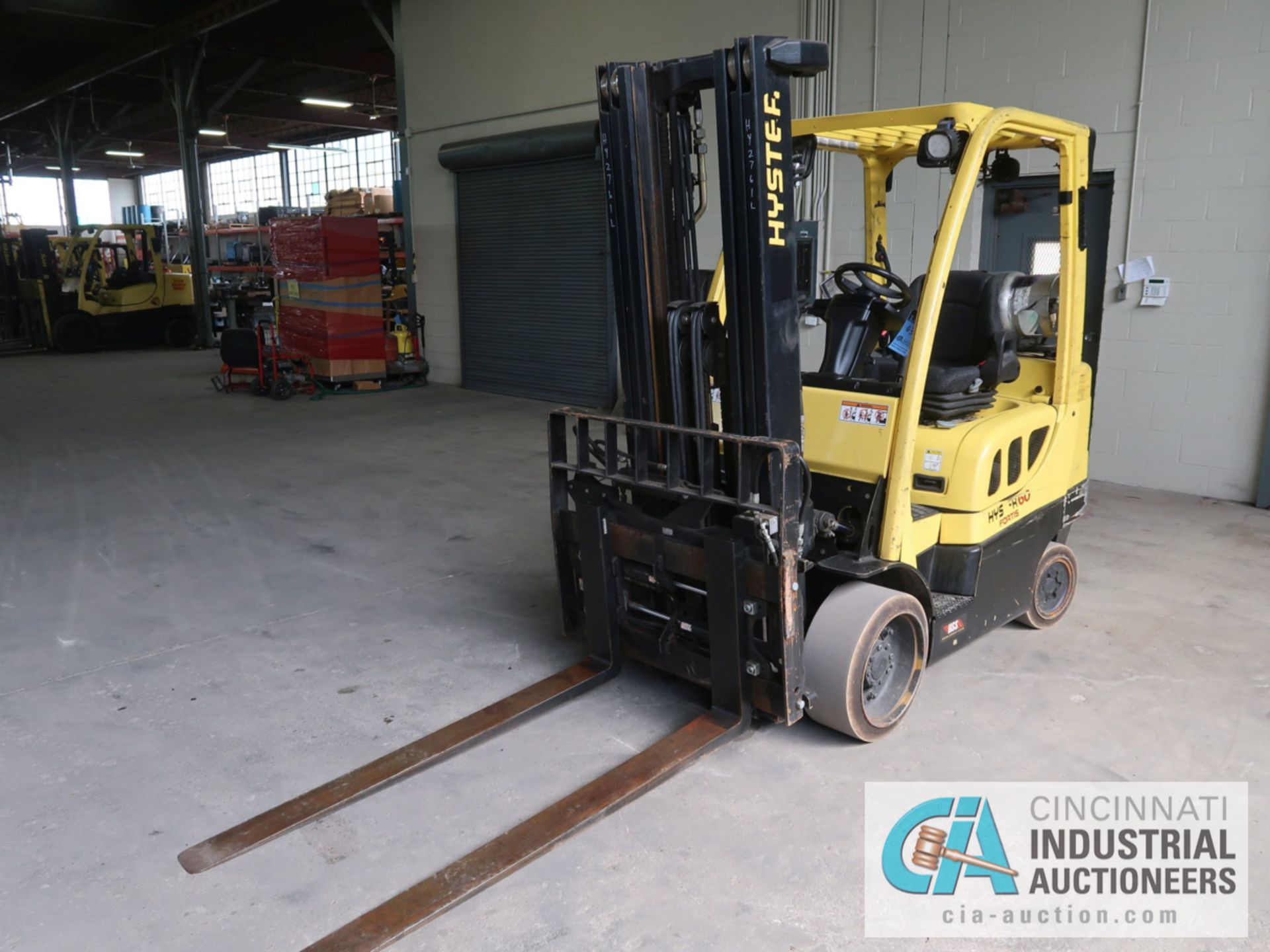 6,000 LB HYSTER MODEL S60FT LP GAS SOLID TIRE LIFT TRUCK WITH 3-STAGE MAST, 187" LIFT HEIGHT, 84"