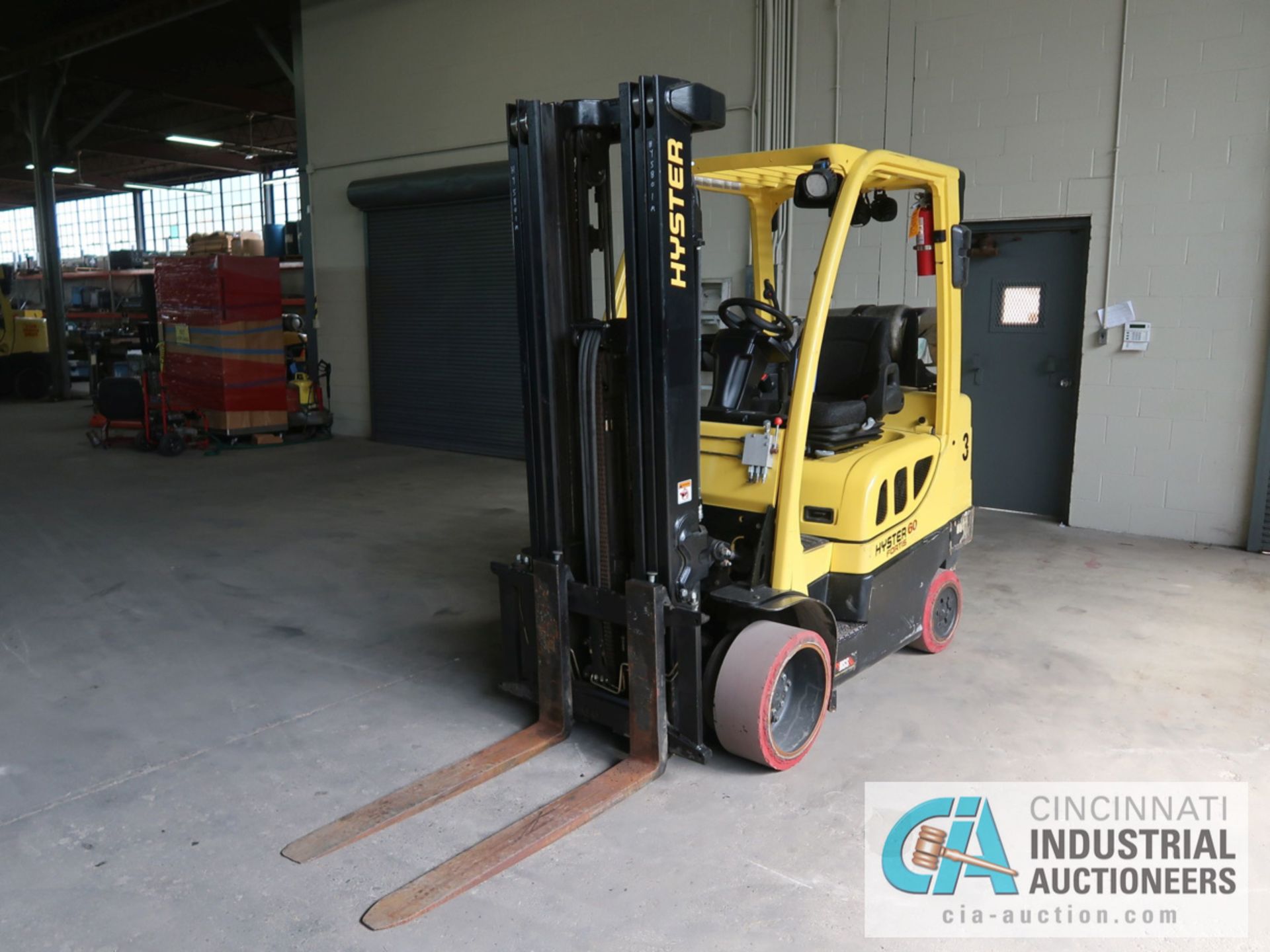 6,000 LB HYSTER MODEL S60FT LP GAS SOLID TIRE LIFT TRUCK WITH 3-STAGE MAST, 187" LIFT HEIGHT, 84"