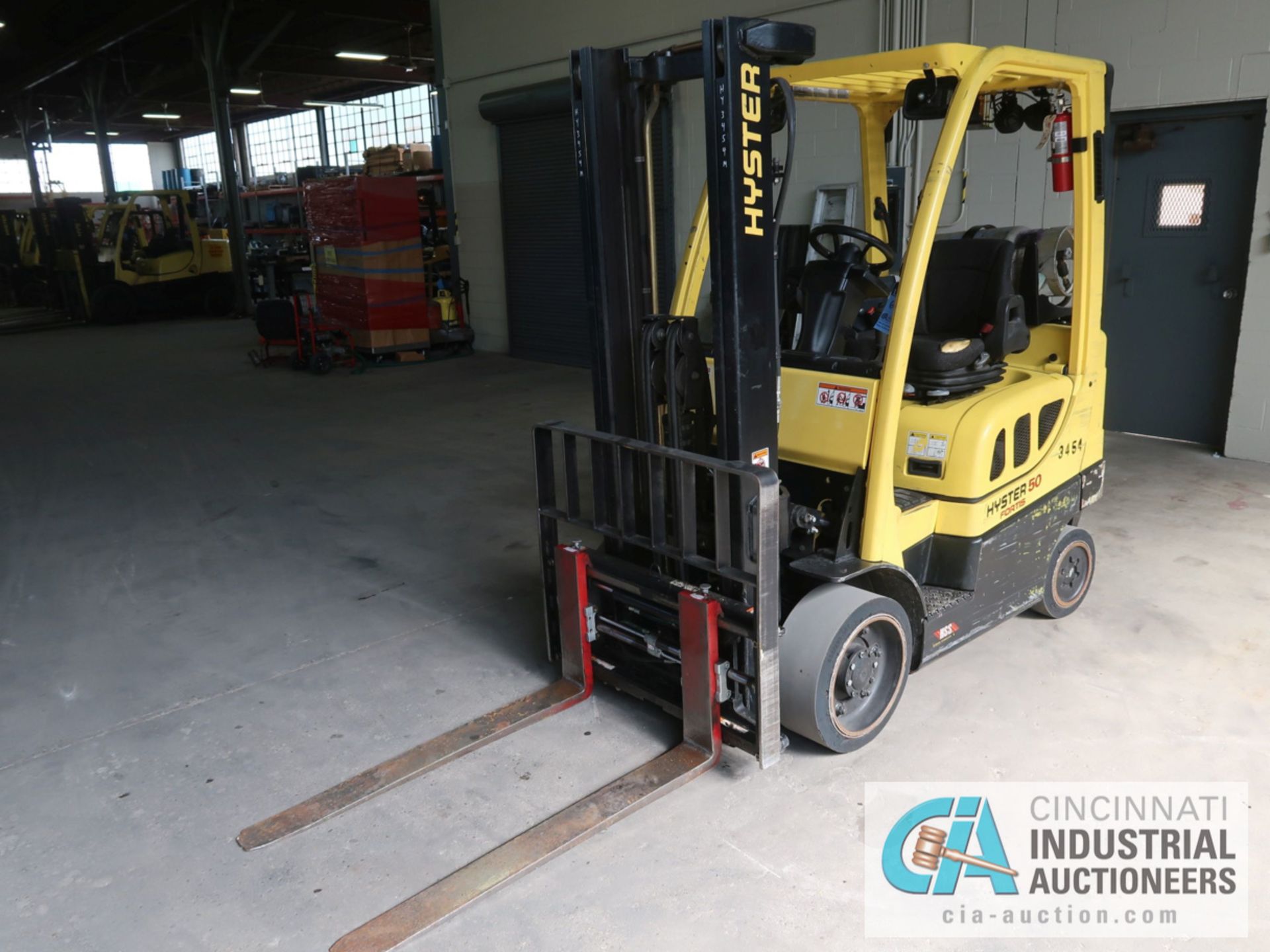 5,000 LB HYSTER MODEL S50FT LP GAS SOLID TIRE LIFT TRUCK WITH 2-STAGE MAST, 130" LIFT HEIGHT, 80"