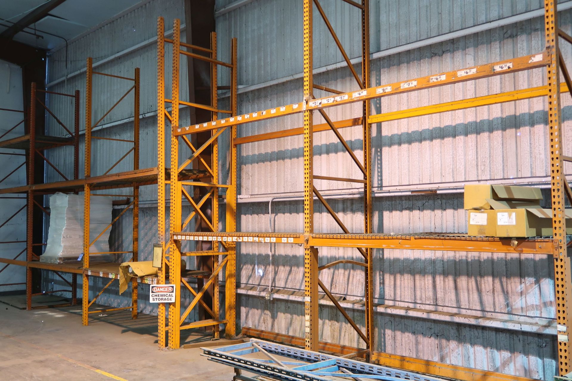 SECT. 42" X 102" X APPROX. 16' H PALLET RACK WITH SKID OF MISC. RACK