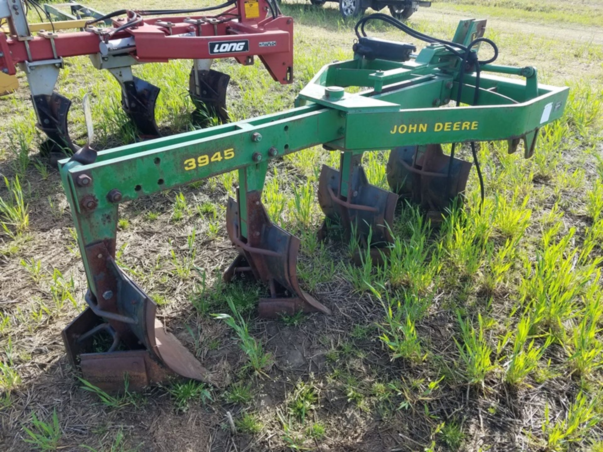 JD 3945 4 bottom switch plow missing tail wheel - Image 4 of 4