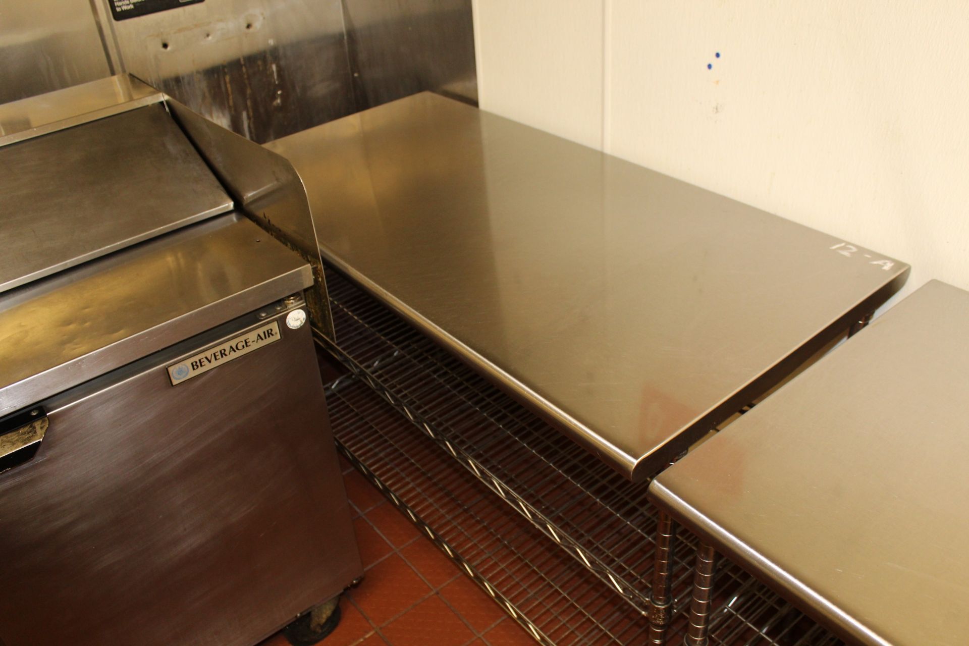 Stainless Steel Table w/ Adjustable Shelves, 24" x 48"