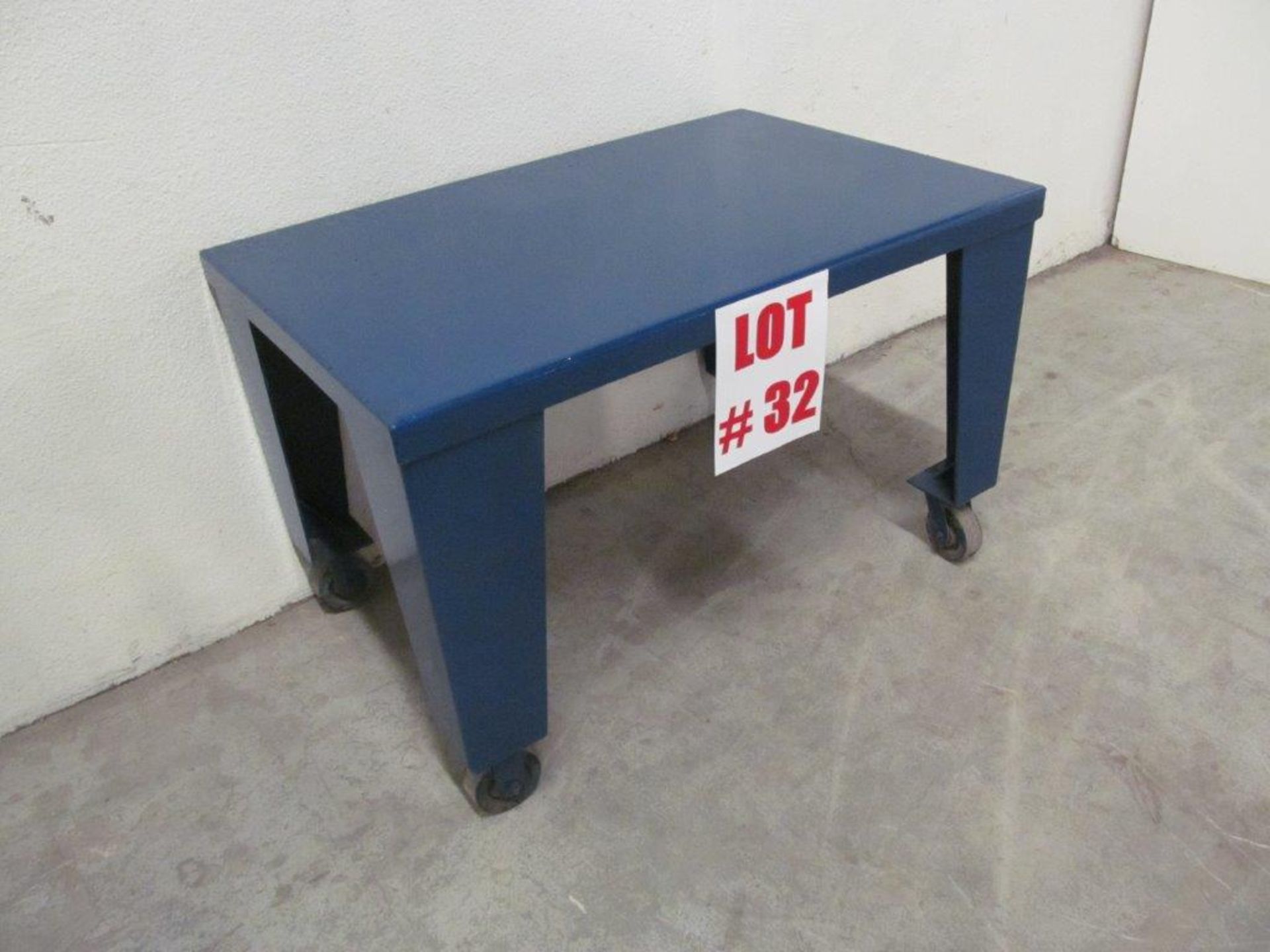 HEAVY DUTY STEEL TABLE ON CASTERS, 4 FT LONG X 32'' WIDE X 31'' HIGH