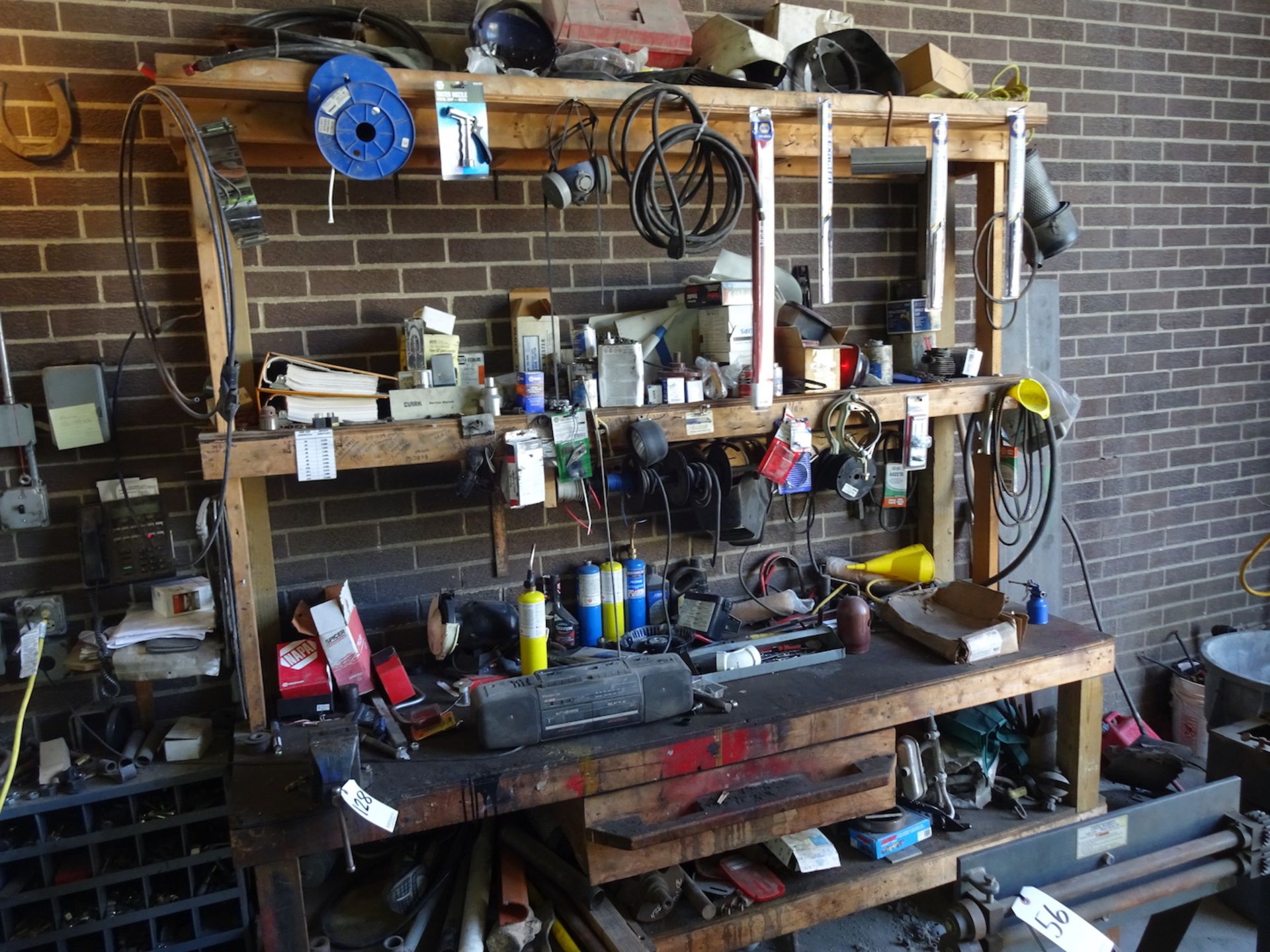 WOOD WORKBENCH WITH 4" BENCH VISE AND MISC. CONTENTS