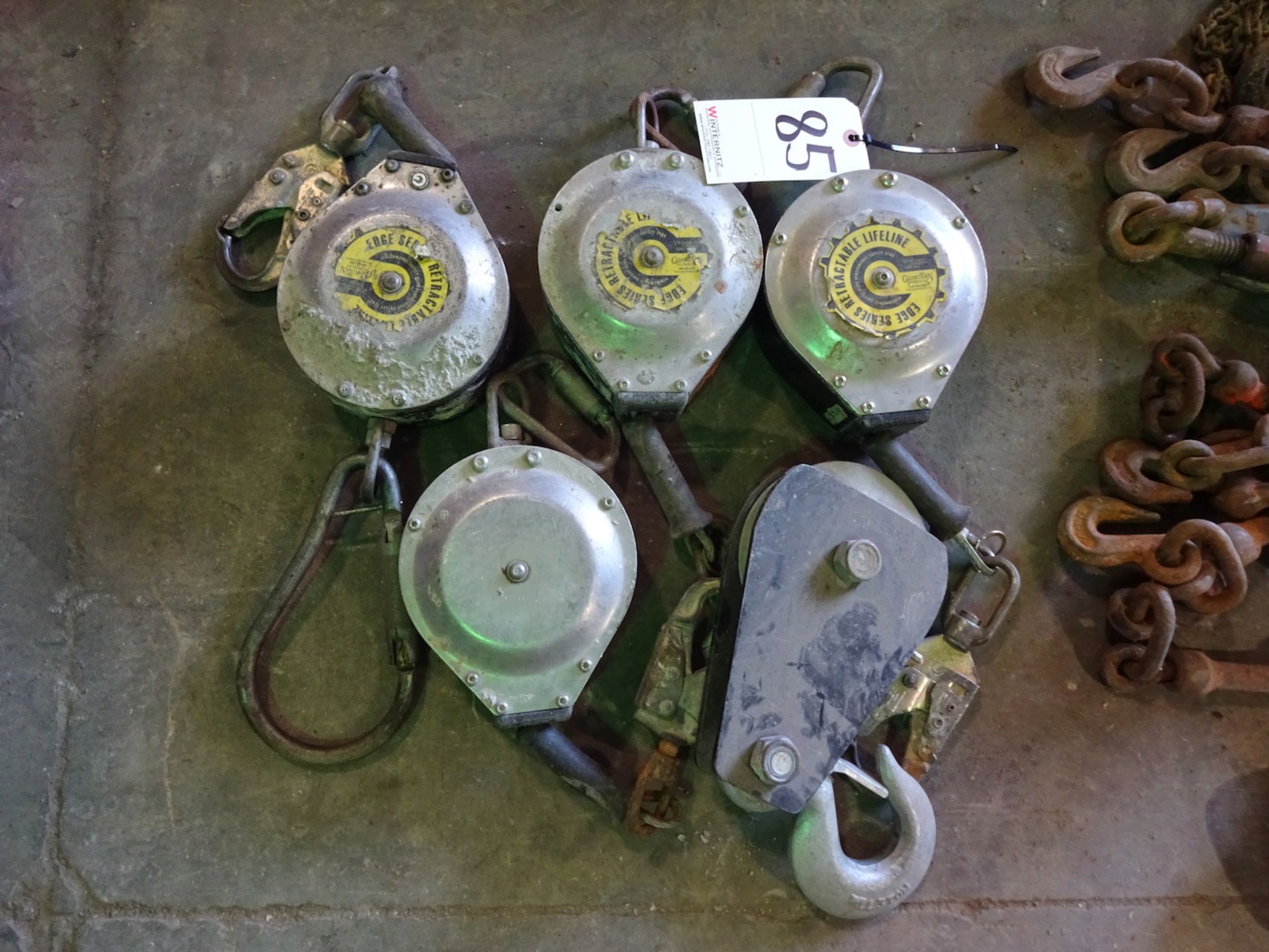 (4) RETRACTABLE LIFELINES AND LARGE PULLEY, NOT CERTIFIED, CONDITION UNKNOWN, PLEASE PLAN ON