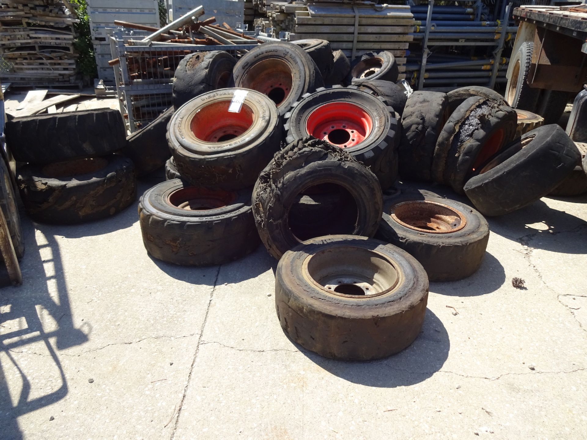 LOT OF ASSORTED BOBCAT WHEELS AND TIRES