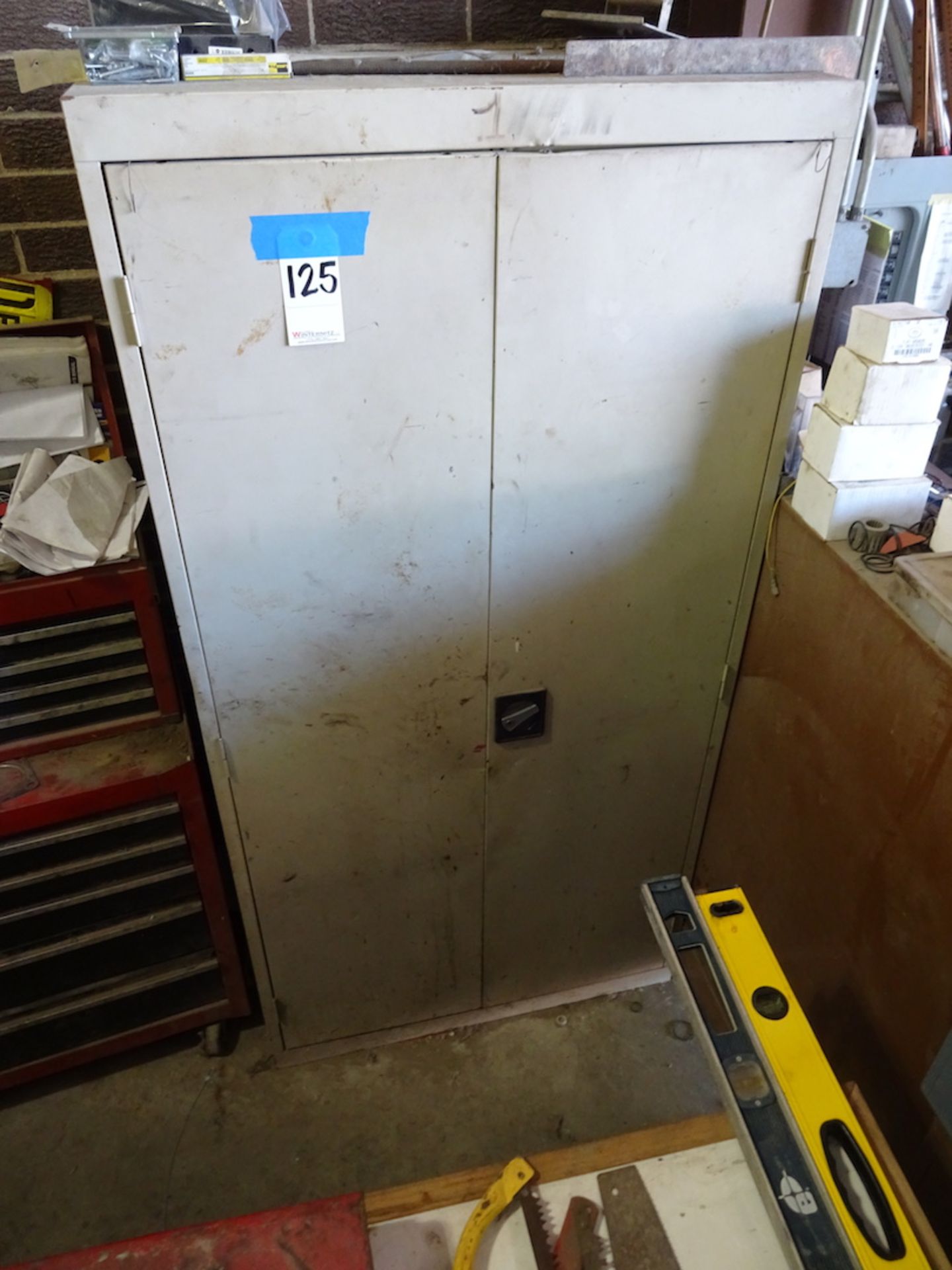 TWO DOOR TAN METAL CABINET WITH CONTENTS, ASSSORTMENT OF PAINT AND MISC.