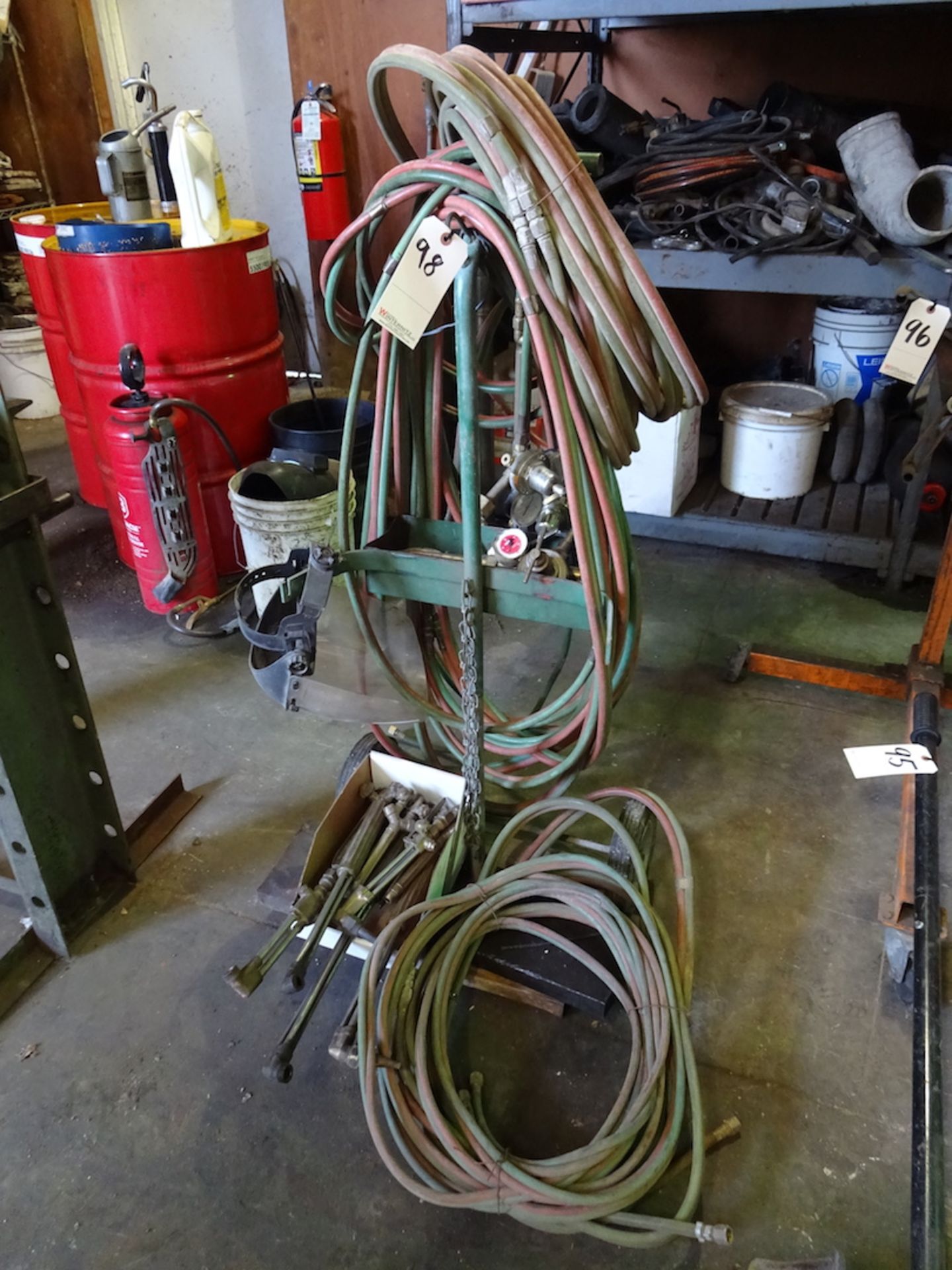 WELDING CART WITH OXYGEN/ACETYLENE GAUGES, LOTS OF TORCHES, HOSES AND FACE SHIELD, NO TANKS