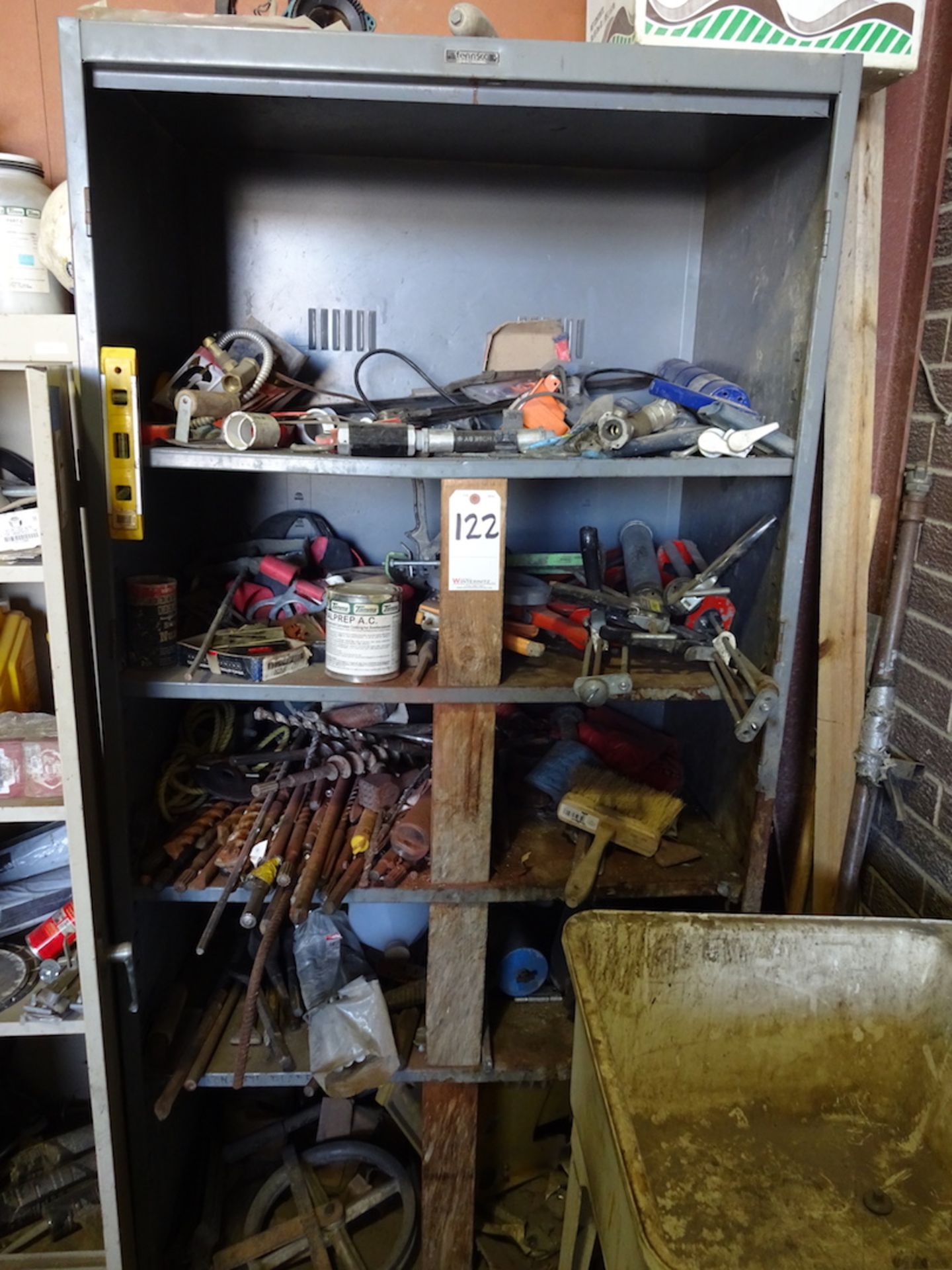 GRAY METAL SHELVING UNIT WITH CONTENTS, BITS, CAULK GUNS, ETC.