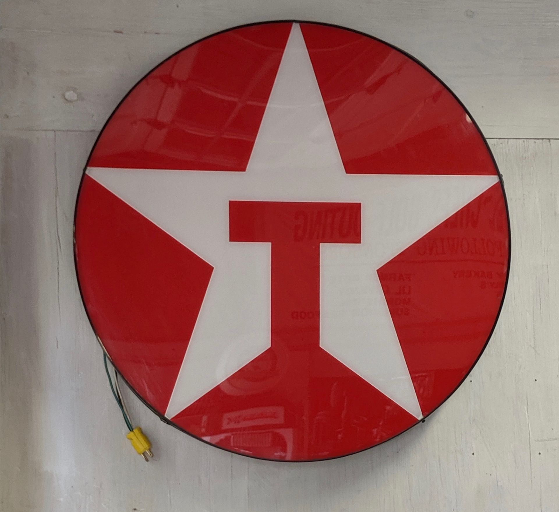 Round lighted Texaco sign