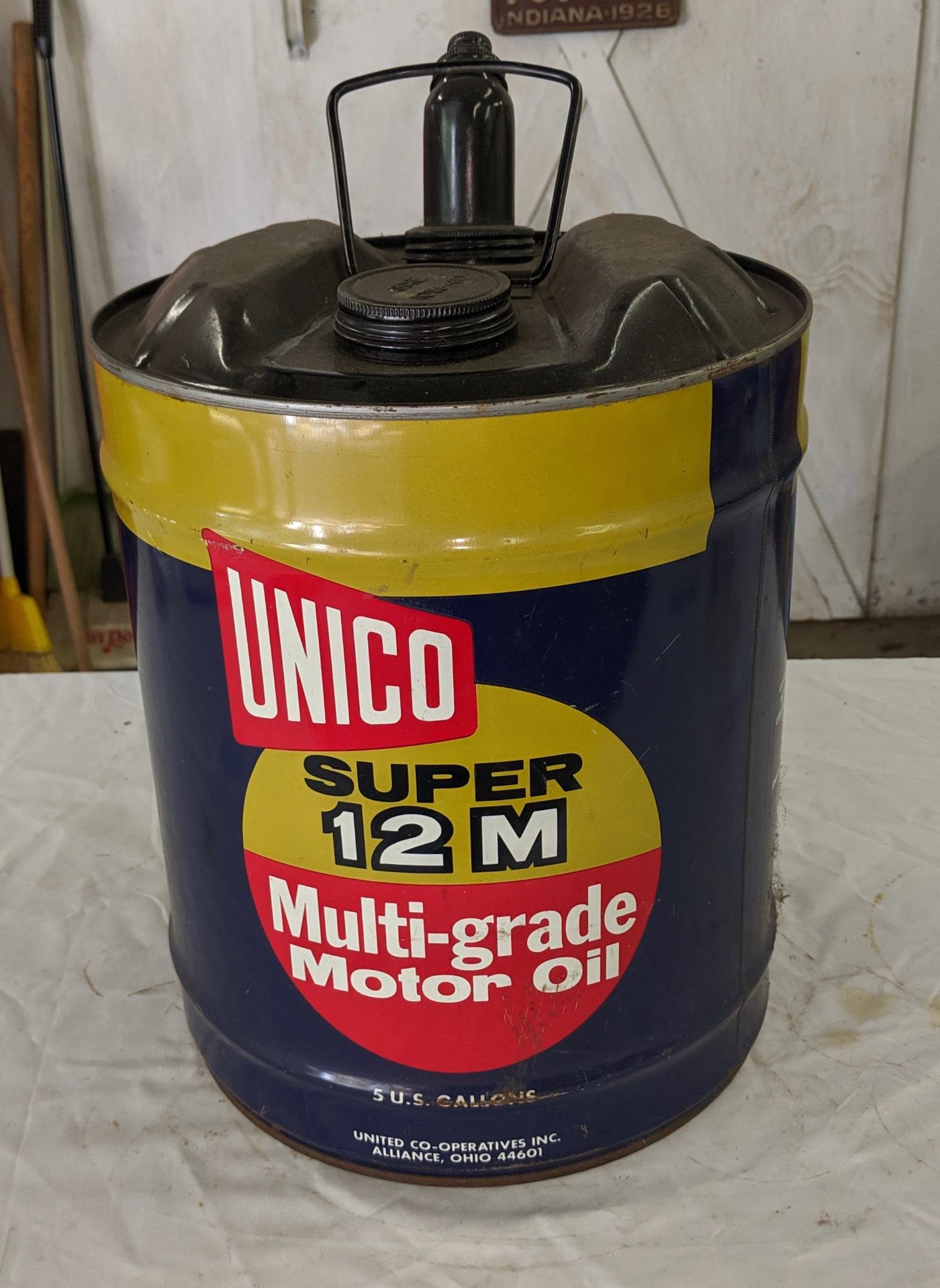 Unico Super 12-M multi-grade motor oil 5 gallon container