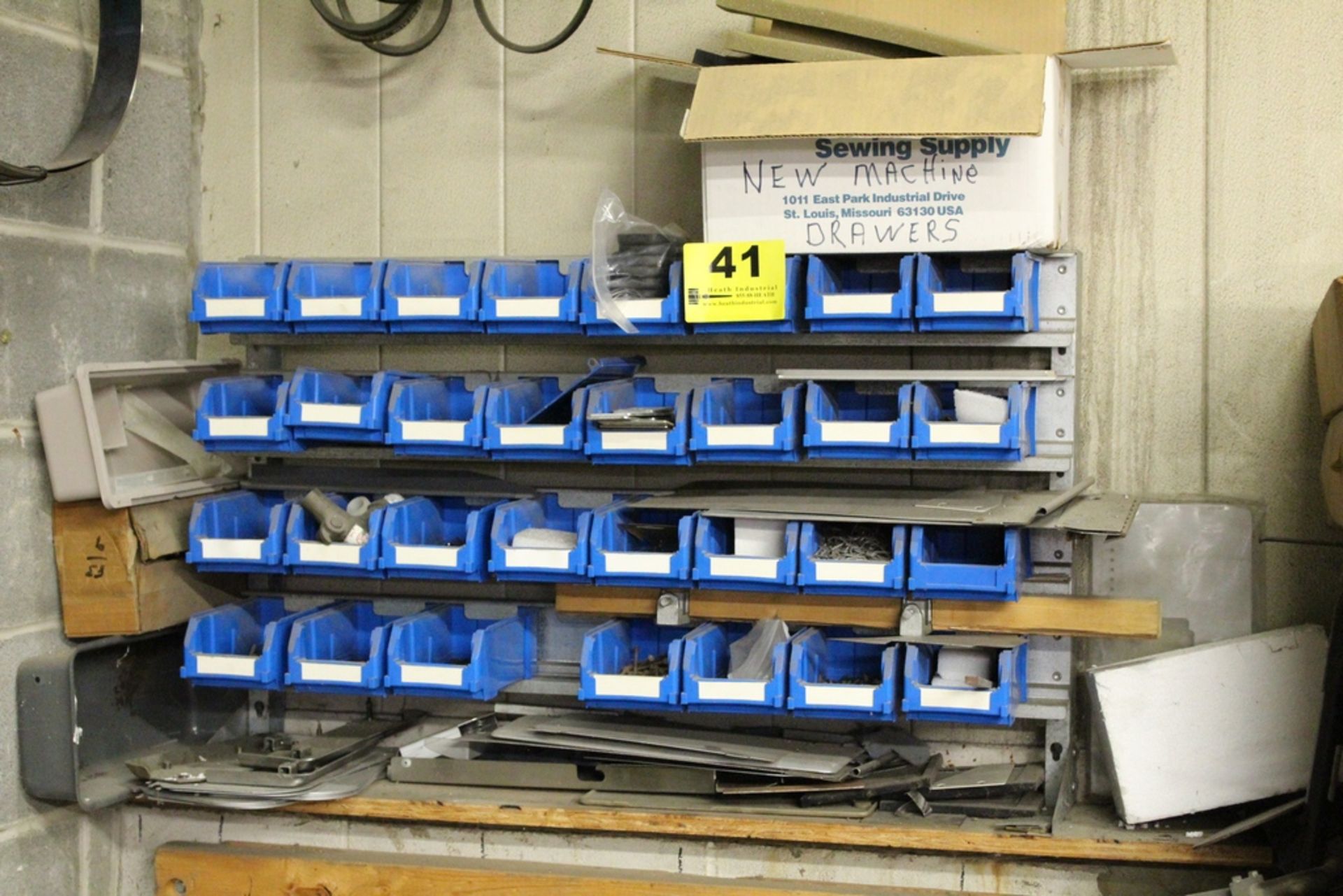 HANGING PLASTIC PARTS BIN AND RACK. 31 BLUE PLASTIC DX 200 PARTS BINS WITH CONTENTS