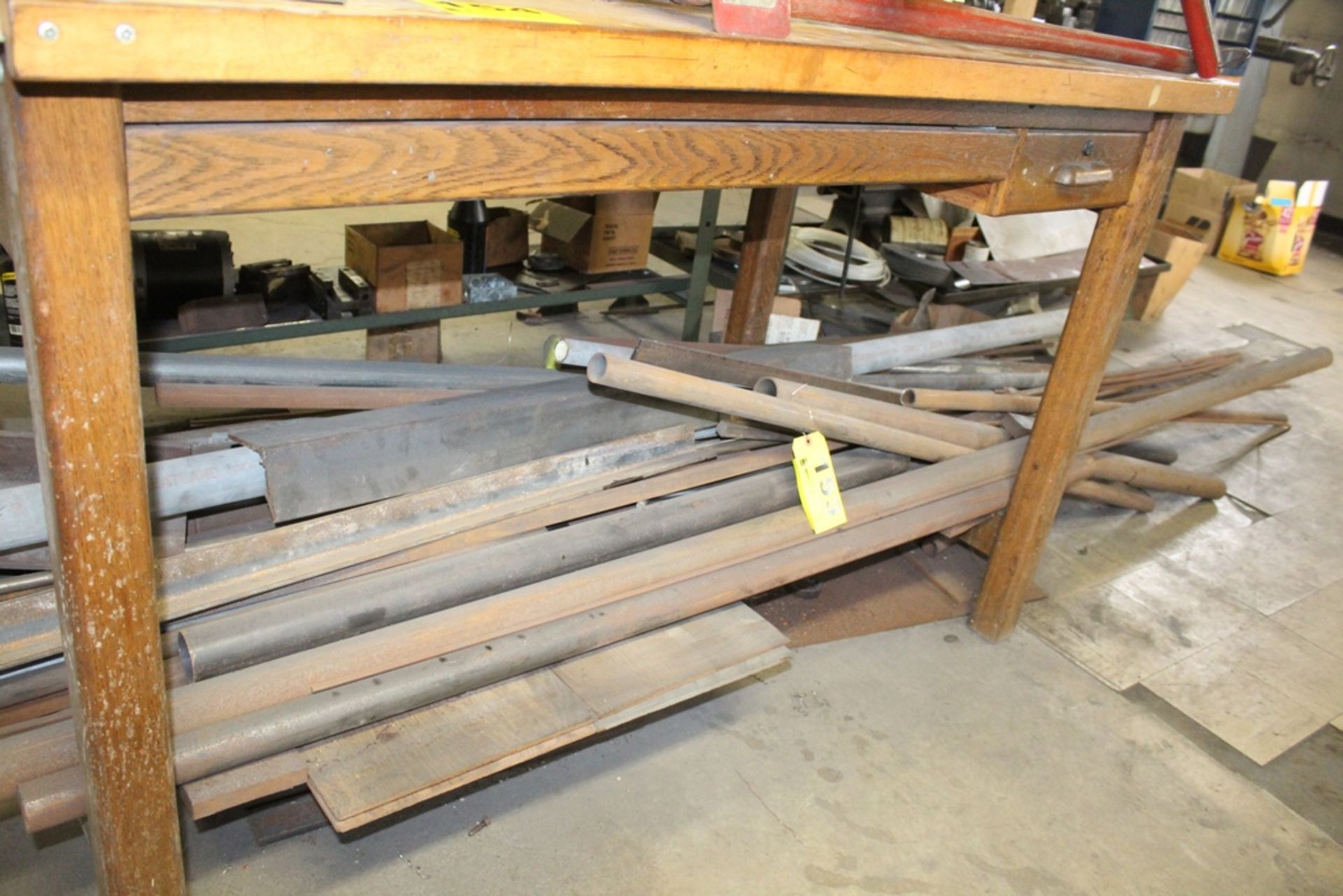 ASSORTED STEEL PIPE UNDER TABLE