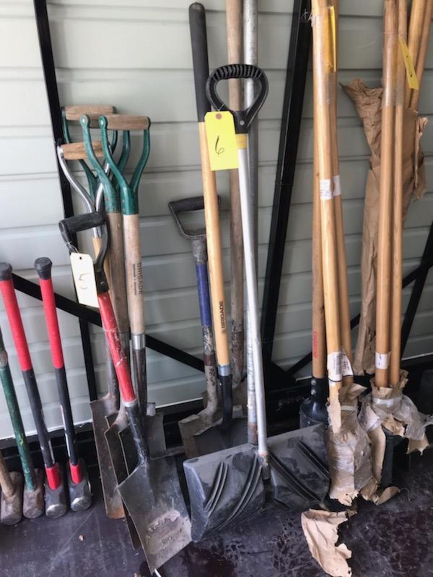 LOT OF SHOVELS AND RAKE